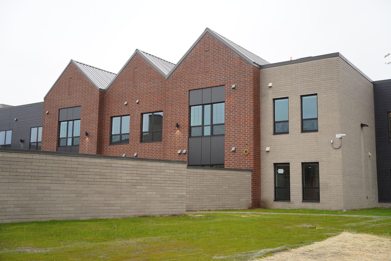 The Pope Francis Center bridge housing facility was designed to look more like condos on the outside as opposed to an institution, feedback Fr. McCabe and his team received from the homeless community itself.