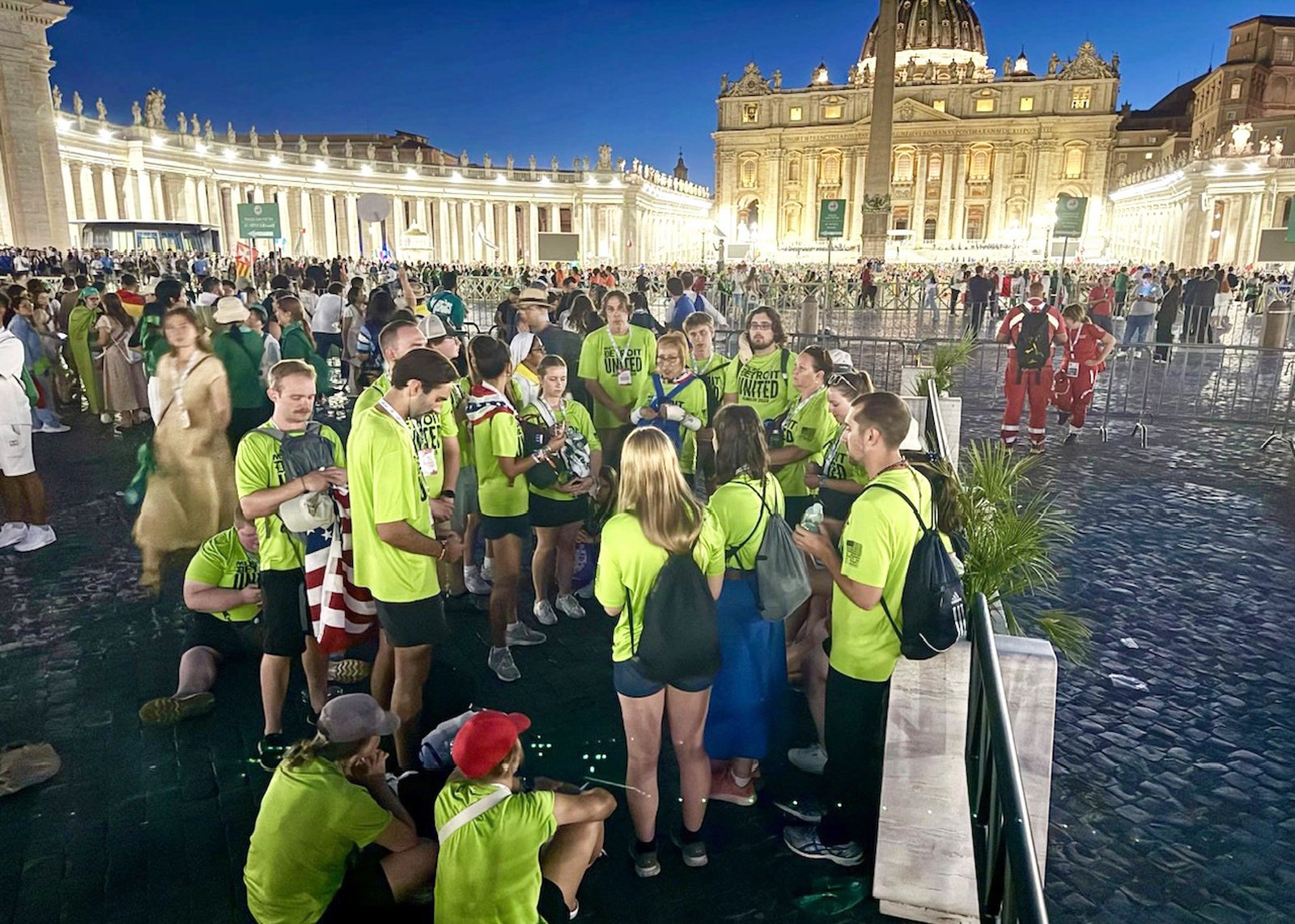 Father-son duo Michael and Jack Novak of Metro Detroit United led a pilgrimage group of teens, ages 13-19, from four parishes: St. Rene Goupil, St. Jane Frances de Chantal, St. Lawrence in Utica, and Our Lady Star of the Sea. They are pictured praying in St. Peter's Square. For many of the young people, seeing the Pope up close was a highlight of their trip. (Photo courtesy of St. René Goupil Parish)