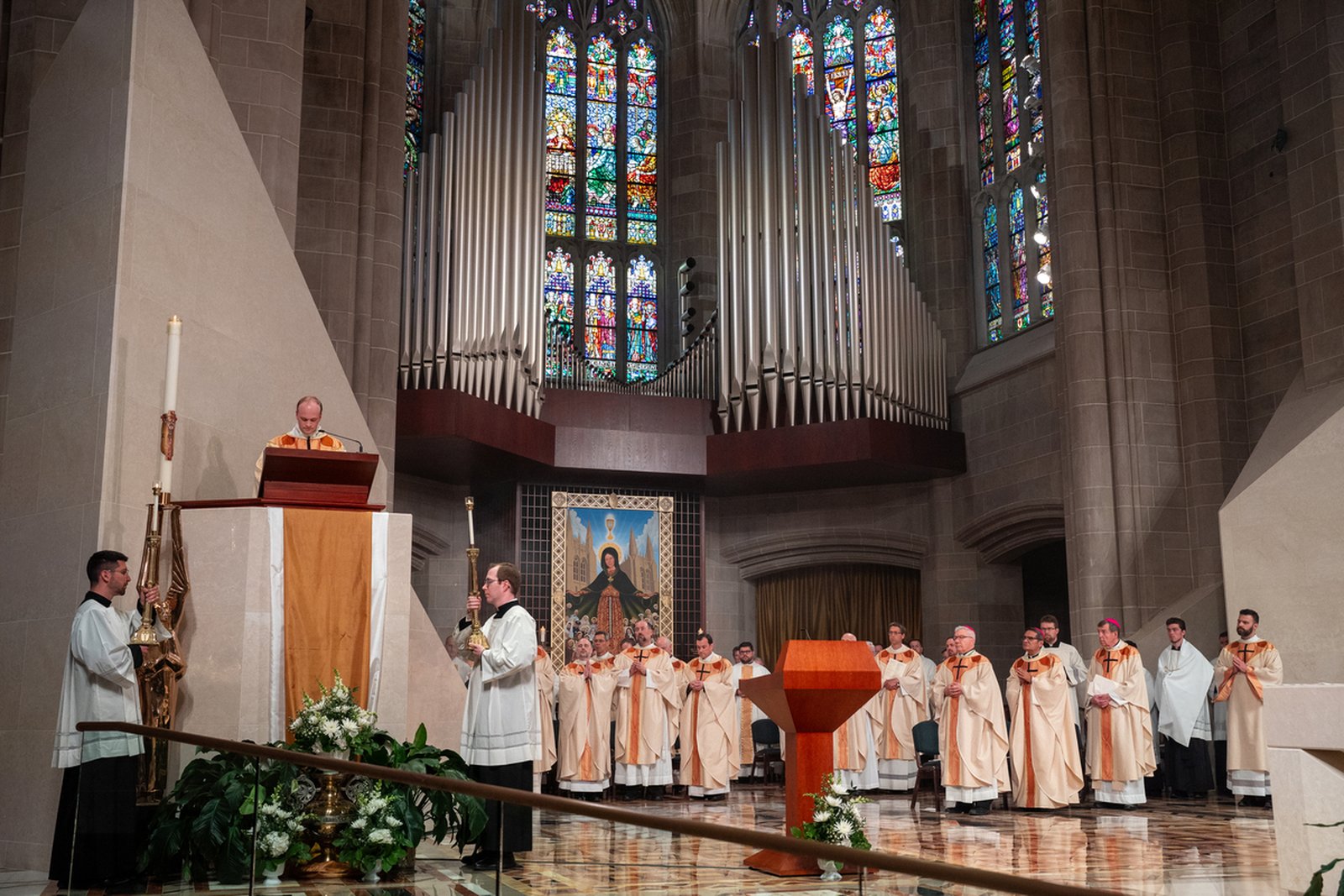 The Gospel is proclaimed during the Liturgy of the Word during the Mass of ordination for Fr. Pat Bruen and Fr. Benjamin Schroder at the Cathedral of the Most Blessed Sacrament.