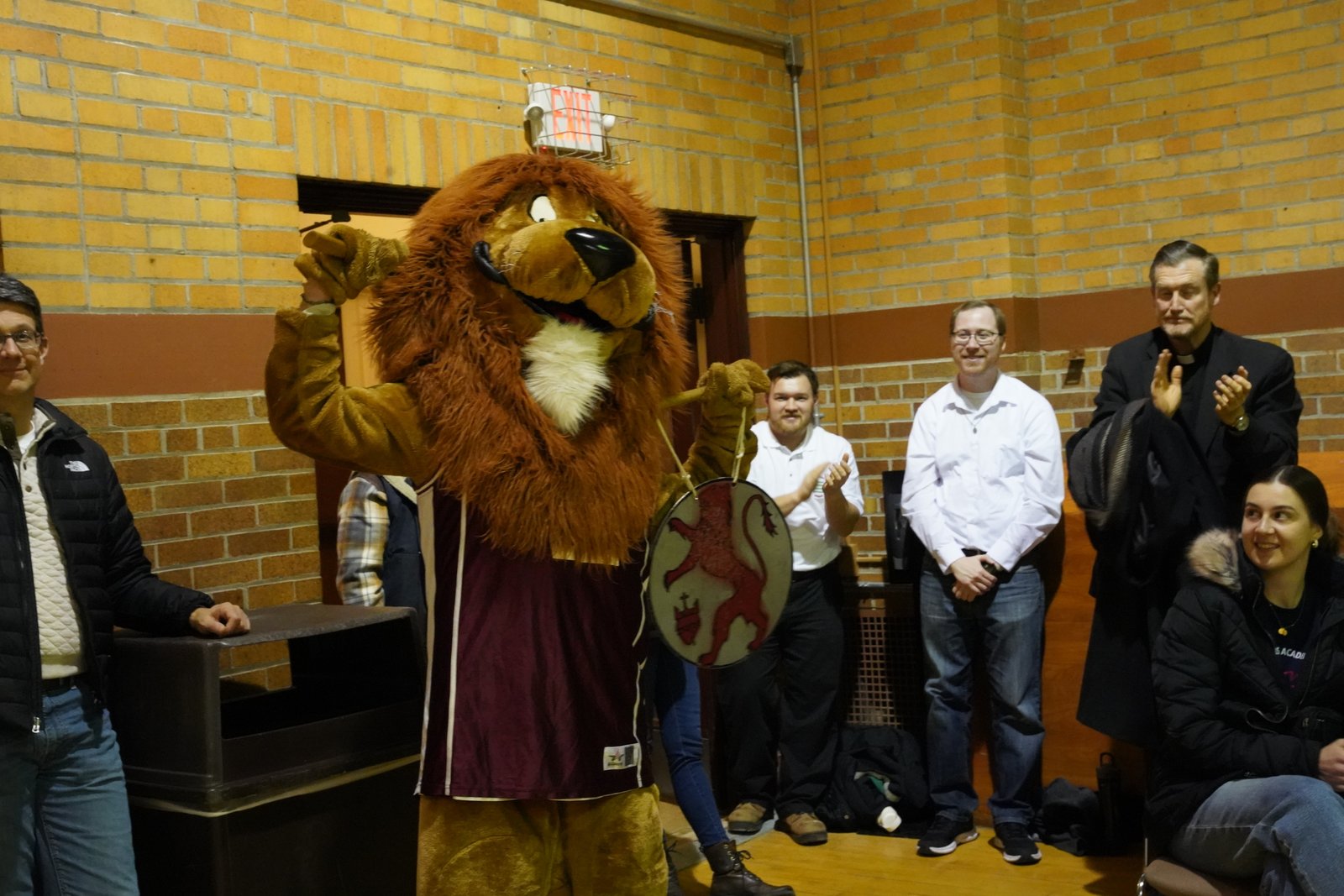 Leo the Lion fires up fans supporting the priests and seminarians.