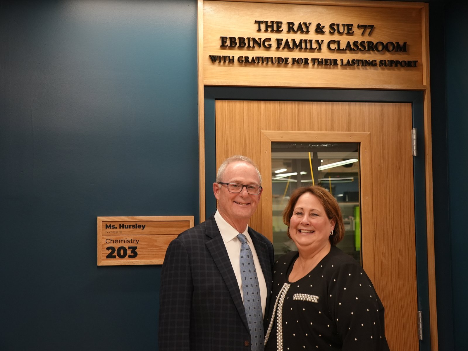 Ray and Sue Ebbin '77 stand in front of the science classroom named in their honor during Marian's ribbon-cutting ceremony for its new art and science wings.