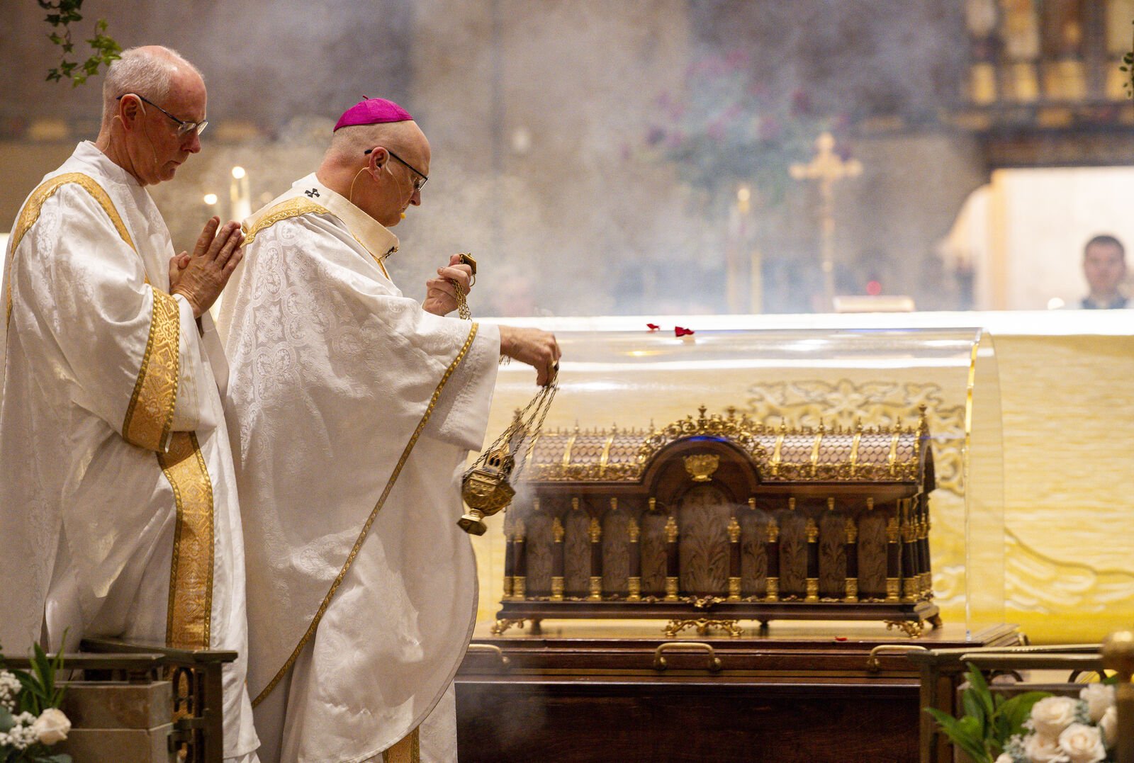 Archbishop Edward J. Weisenburger incenses the relics of St. Therese of Lisieux to begin Mass on her feast day.