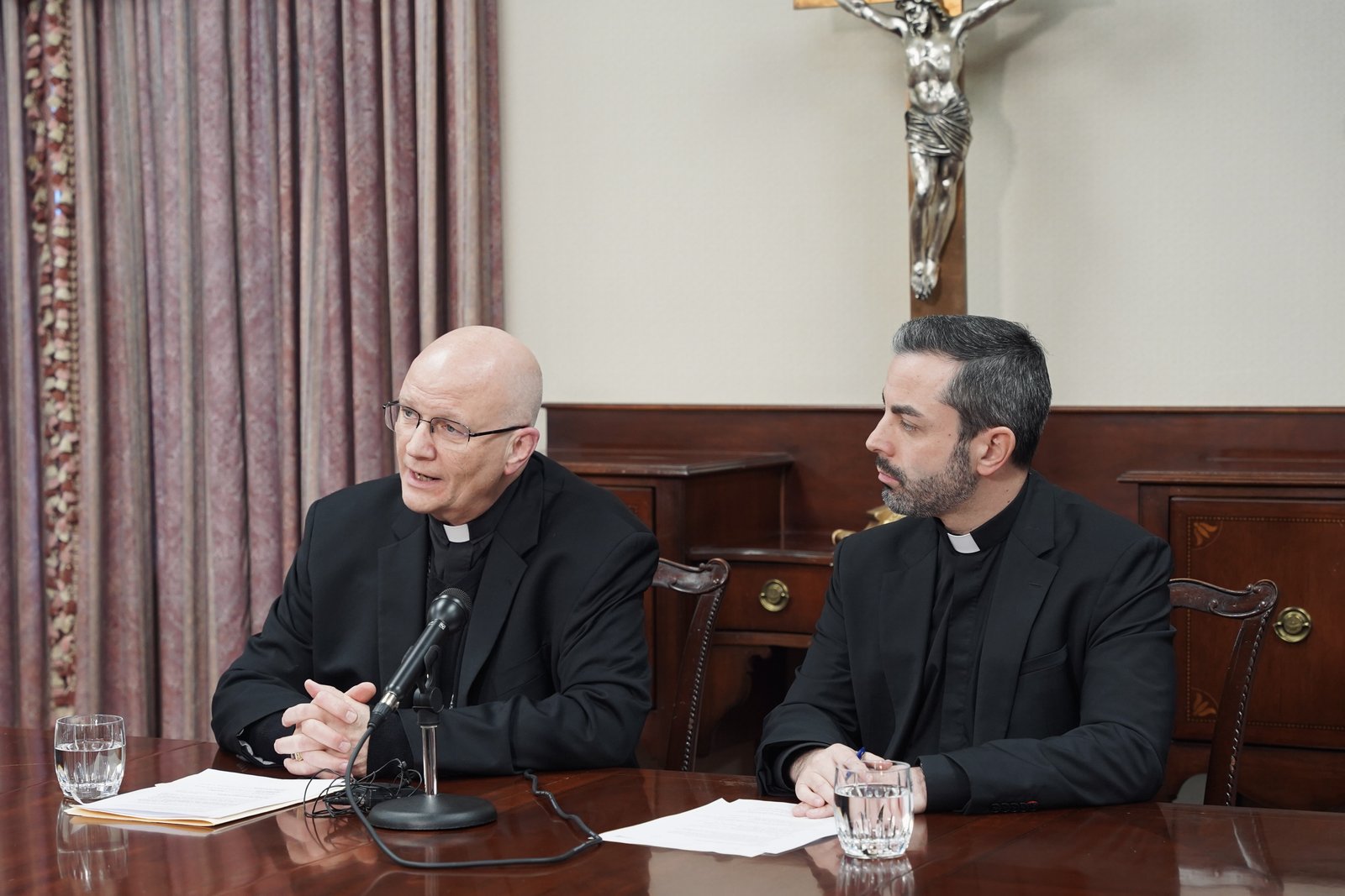 Detroit Archbishop Edward J. Weisenburger, left, and Fr. Mario Amore, executive director of the Archdiocese of Detroit's Department of Parish Renewal, address members of the media Nov. 17 during a news conference at the Cathedral of the Most Blessed Sacrament in Detroit.