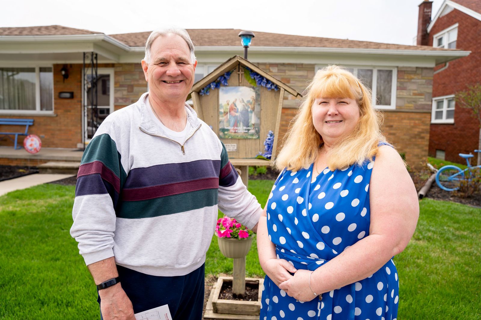 Barbara and Michael Bozymowski, parishioners of Our Lady of the Scapular Parish in Wyandotte, host the second Joyful Mystery rosary station in their front yard. The box was installed when Michael's parents owned the home, and the couple decided to keep it after they took ownership of the house, believing it was a good way to promote their faith in the community.