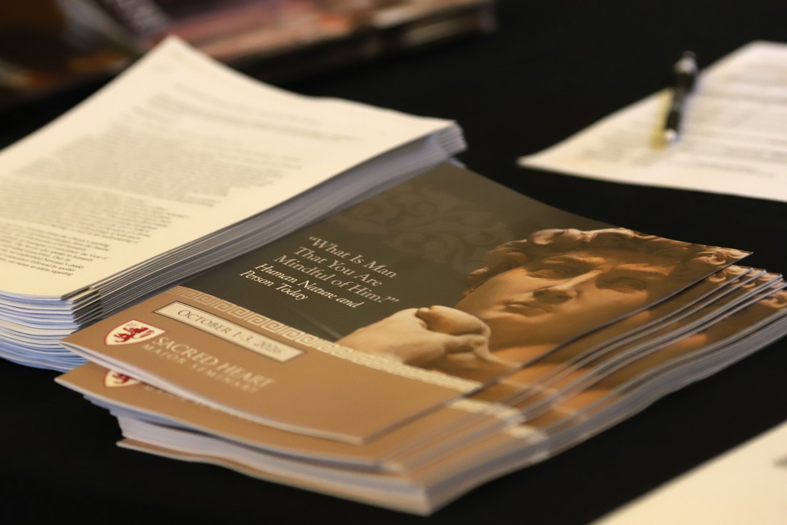 A cover of the program booklet for the academic conference at Sacred Heart Major Seminary.