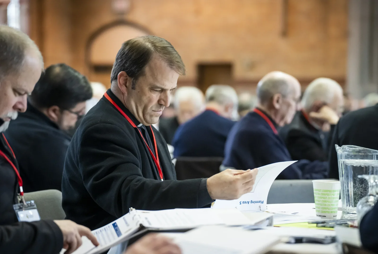 Priests of the Archdiocese of Detroit examine proposals for new pastorate models during a meeting at Sacred Heart Major Seminary in March. The models to be presented to parishioners during the listening sessions were developed by priests of the archdiocese in consultation with the Department of Parish Renewal.