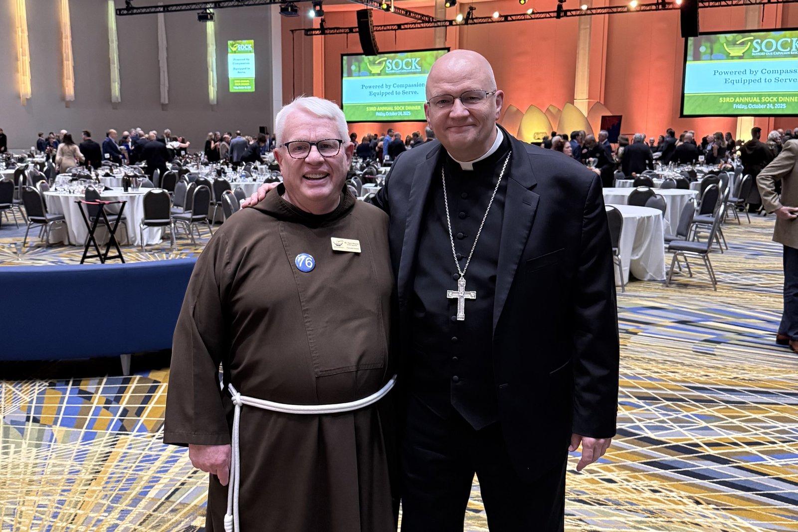 Archbishop Weisenburger is pictured with Bro. Gary Wegner, OFM Cap., executive director of the Capuchin Soup Kitchen.