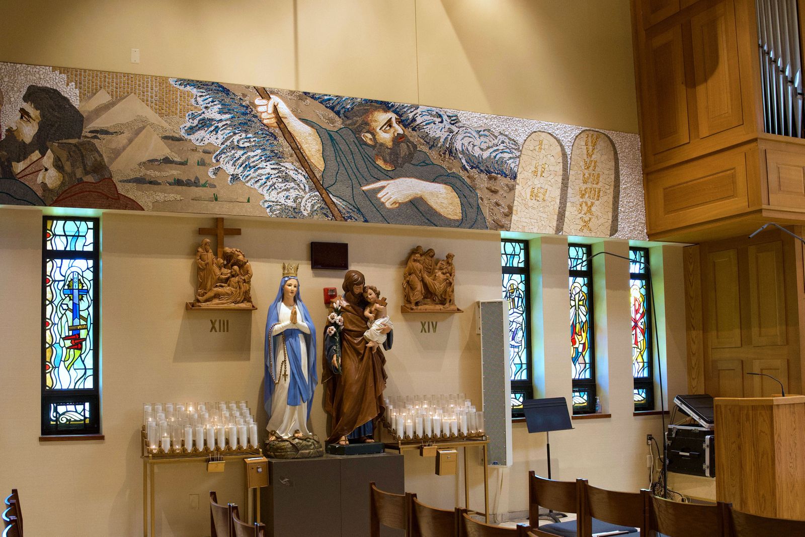 A panel of the mosaic depicts Moses with the Ten Commandments, with the Red Sea parted behind him.