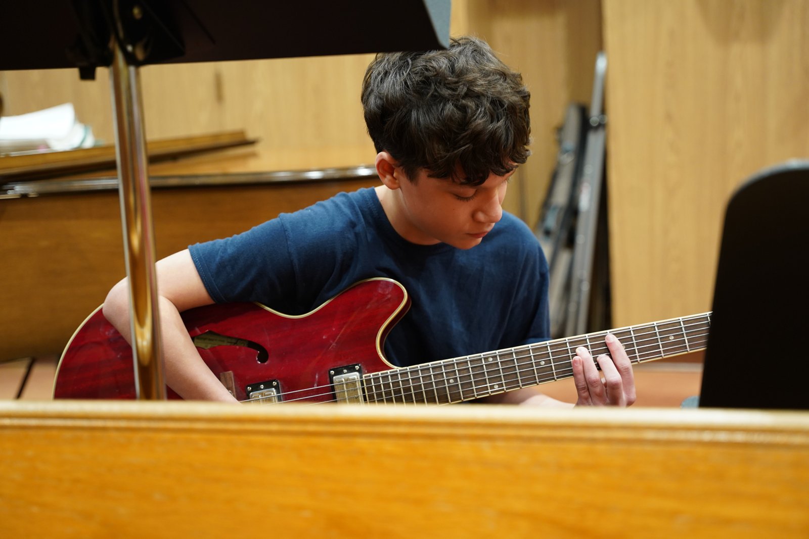 Stallone Kubica, a student in the religious education program, plays "Tastes and See" on his guitar during the Santa Bears program at St. Kateri Parish.