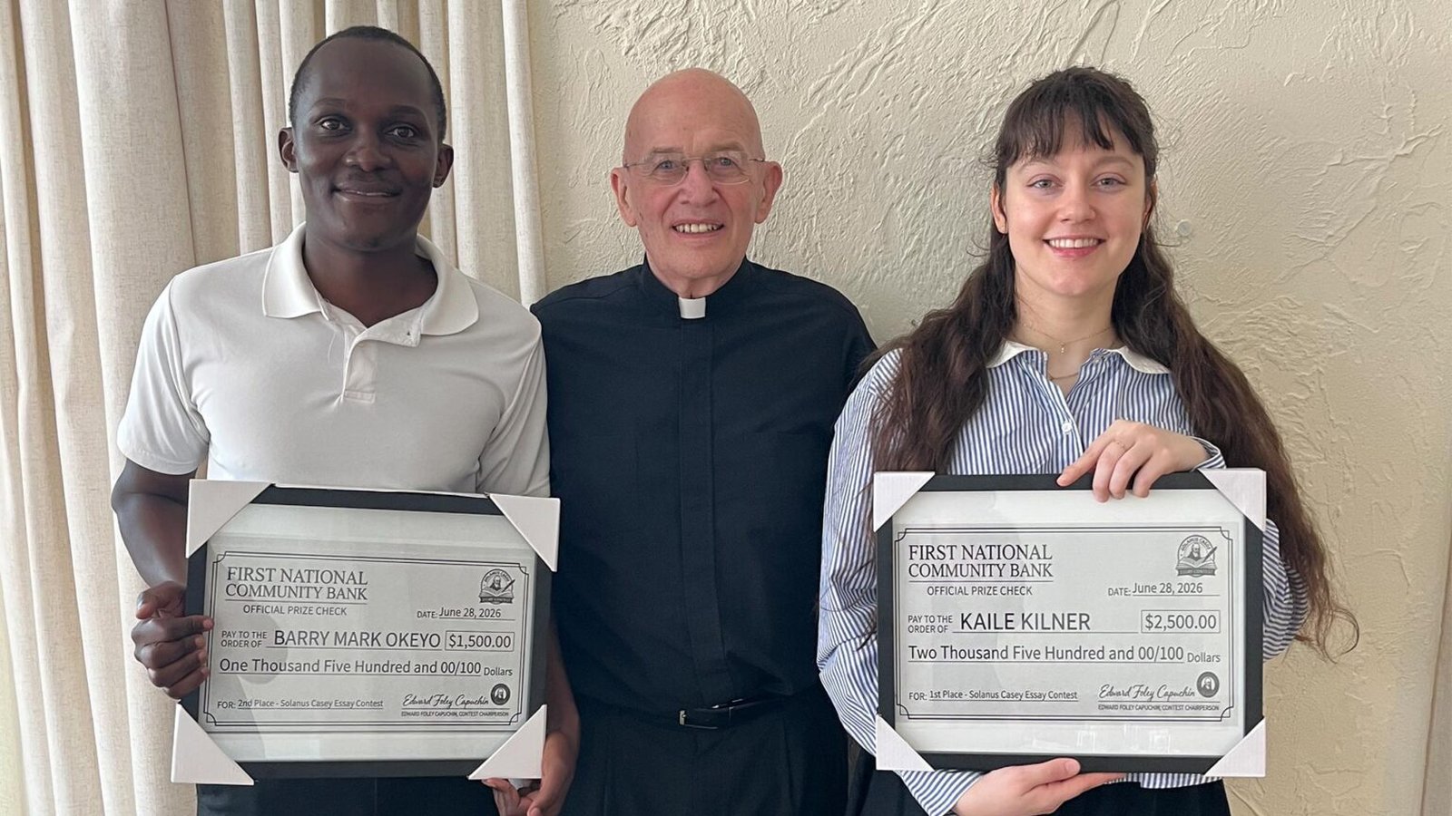 Fr. Edward Foley, OFM Cap., center, vice postulator for the canonization cause of Blessed Solanus Casey, awards Kaile Kilner, right, and Barry Mark Okeyo, left, with certificates as the first- and second-place winners. Dr. César A. Cruz, not pictured, won third place. (Photo courtesy of the Capuchin Franciscan Province of St. Joseph)