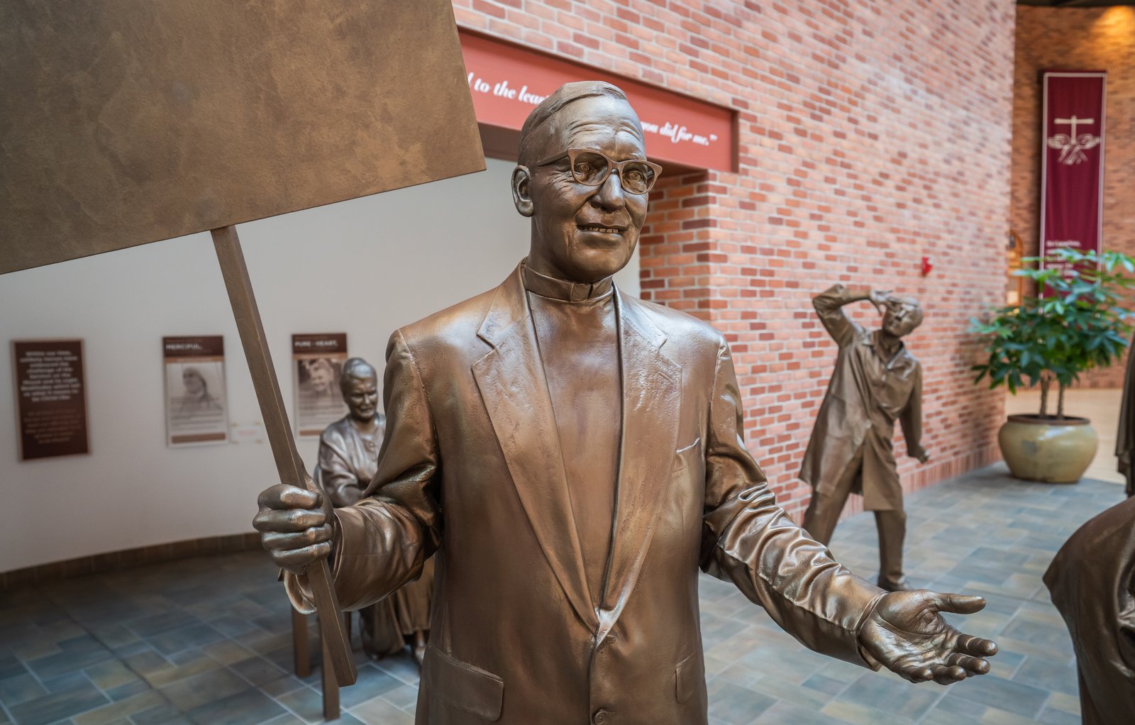 A bronze Monsignor Clement Kern statue sits in the center's entryway. The statue is one of eight saintly men and women who represent the beatitudes.