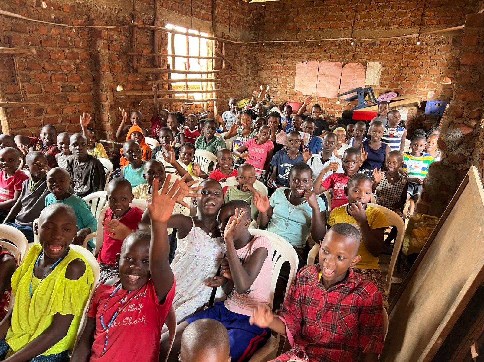 St. Kizito students are pictured during an assembly. A scholarship program that allows children to graduate not just from high school, but to attend trade school or college, Walker said.