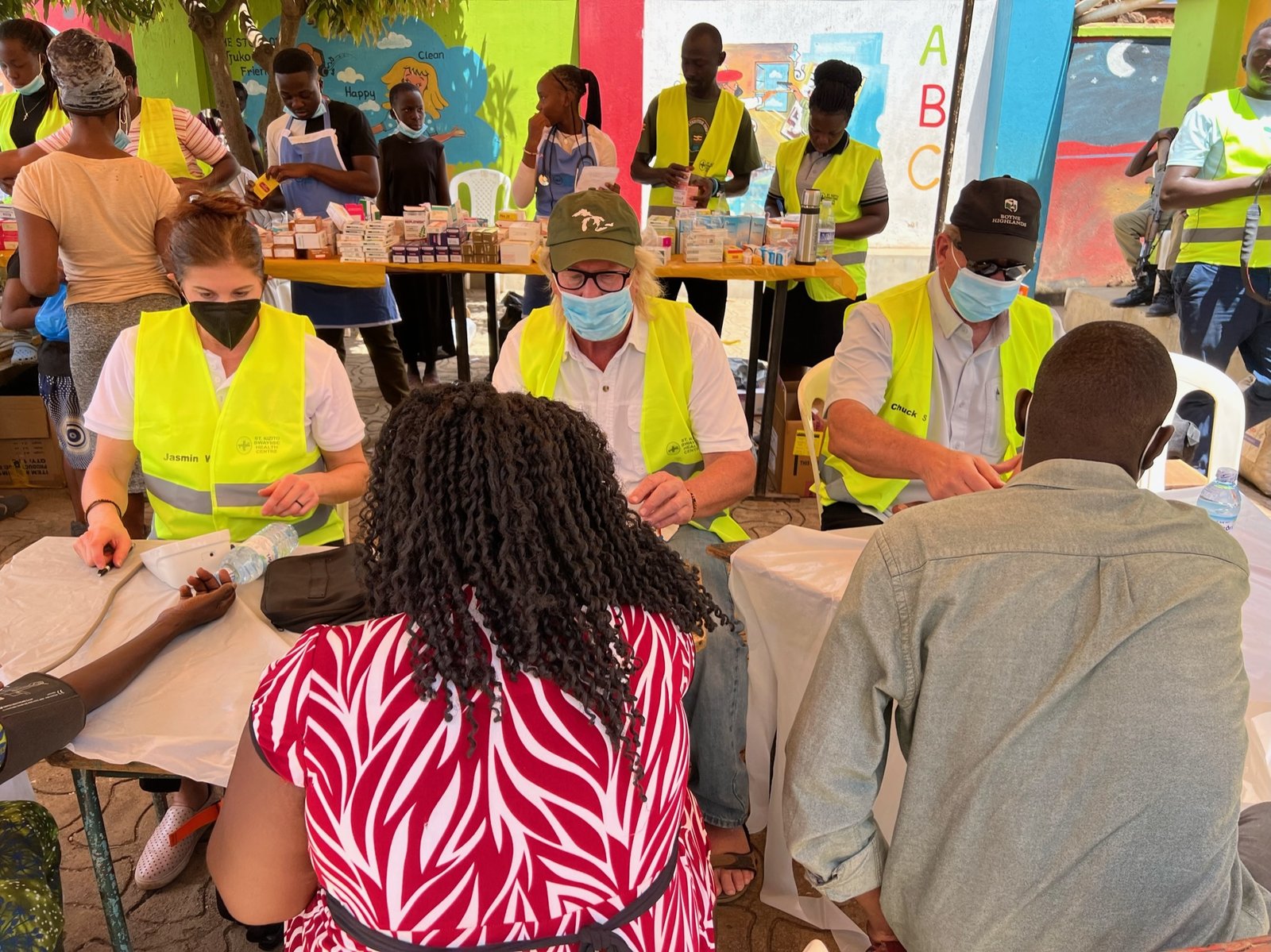 Jasmin Walker, Bill Tulloch and Chuck Salter work at a medical outreach event in the neighboring slums.