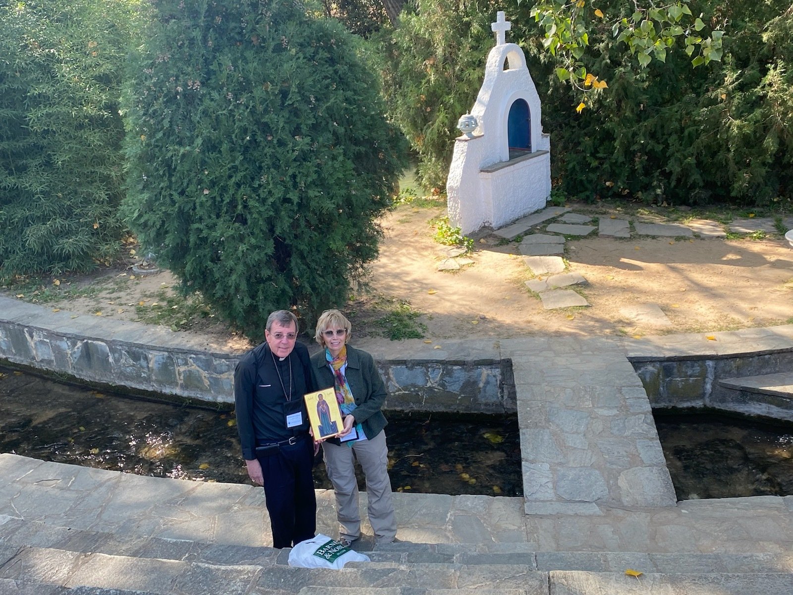 McCann and Archbishop Vigneron hold an icon of St. Lydia, near the place where she was baptized.