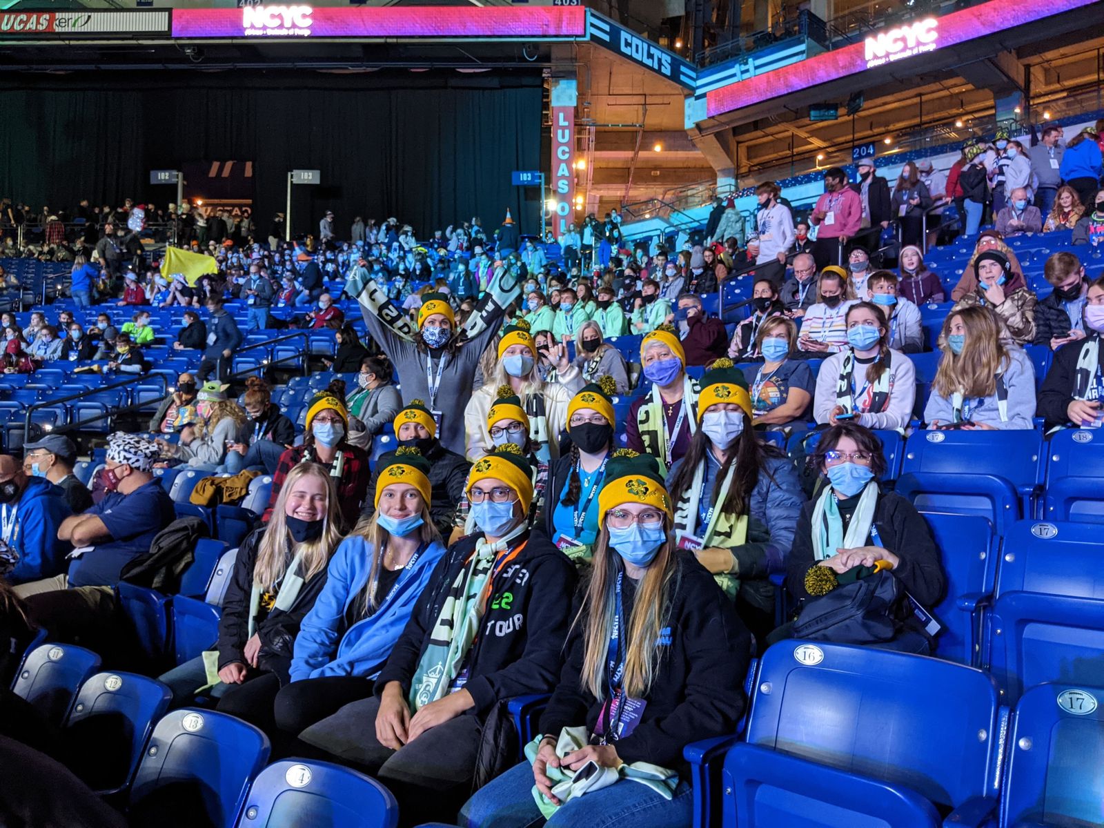 Young people from St. Patrick Parish in White Lake and St. William Parish in Walled Lake get ready for the keynote speaker at Lucas Oil Stadium in Indianapolis.