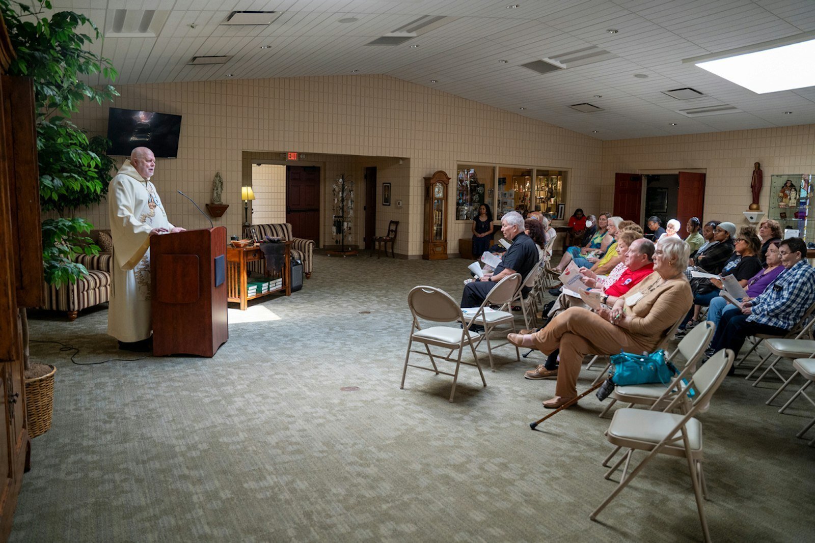Deacon Steve Morello explains elements of American Indian culture demonstrated during the prayer gathering.