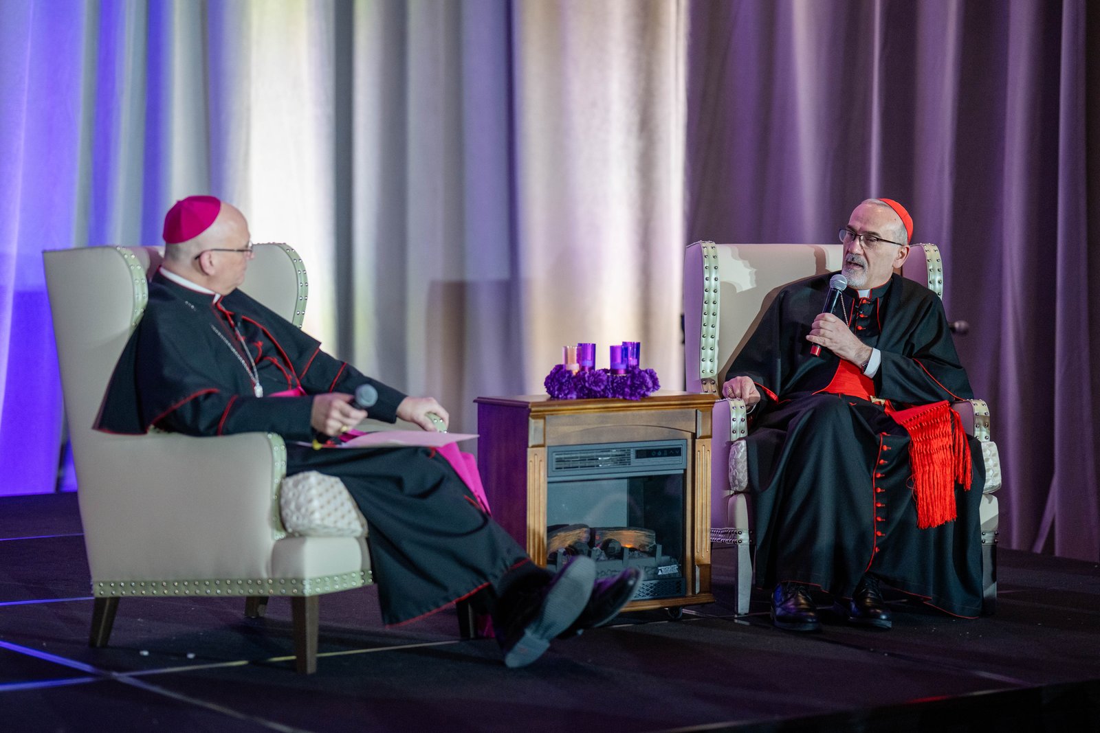Detroit Archbishop Edward J. Weisenburger, left, and Cardinal Pierbattista Pizzaballa, OFM, the Latin patriarch of Jerusalem, engage in conversation about the cardinal's ministry during the challenging situation in Gaza and the Holy Land during a fundraising dinner Dec. 5 at St. John's Resort in Plymouth.