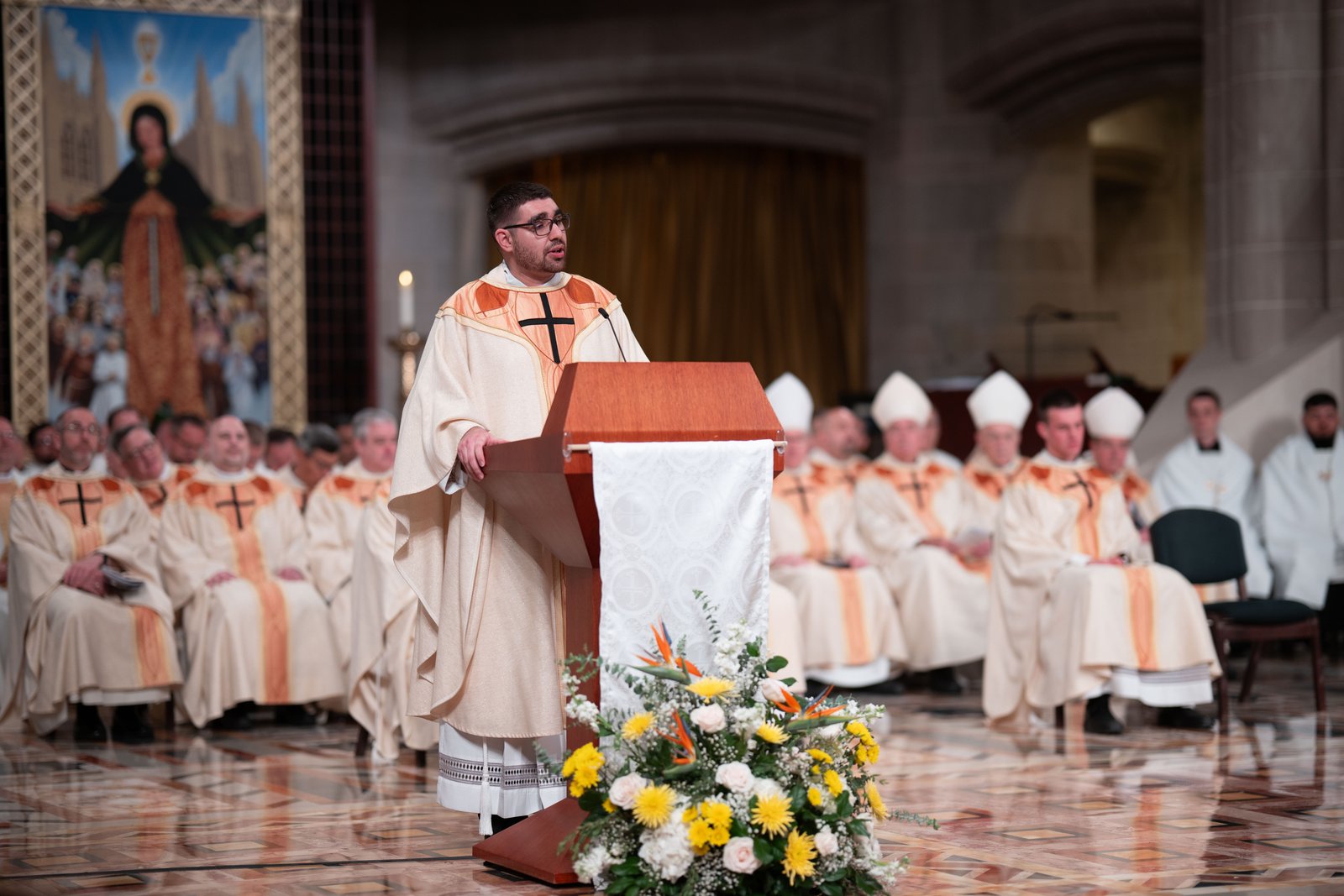 Fr. Lizandro Barba speaks on behalf of his ordination classmates, offering words of gratitude to God and those who played a role in the new priests' vocations.
