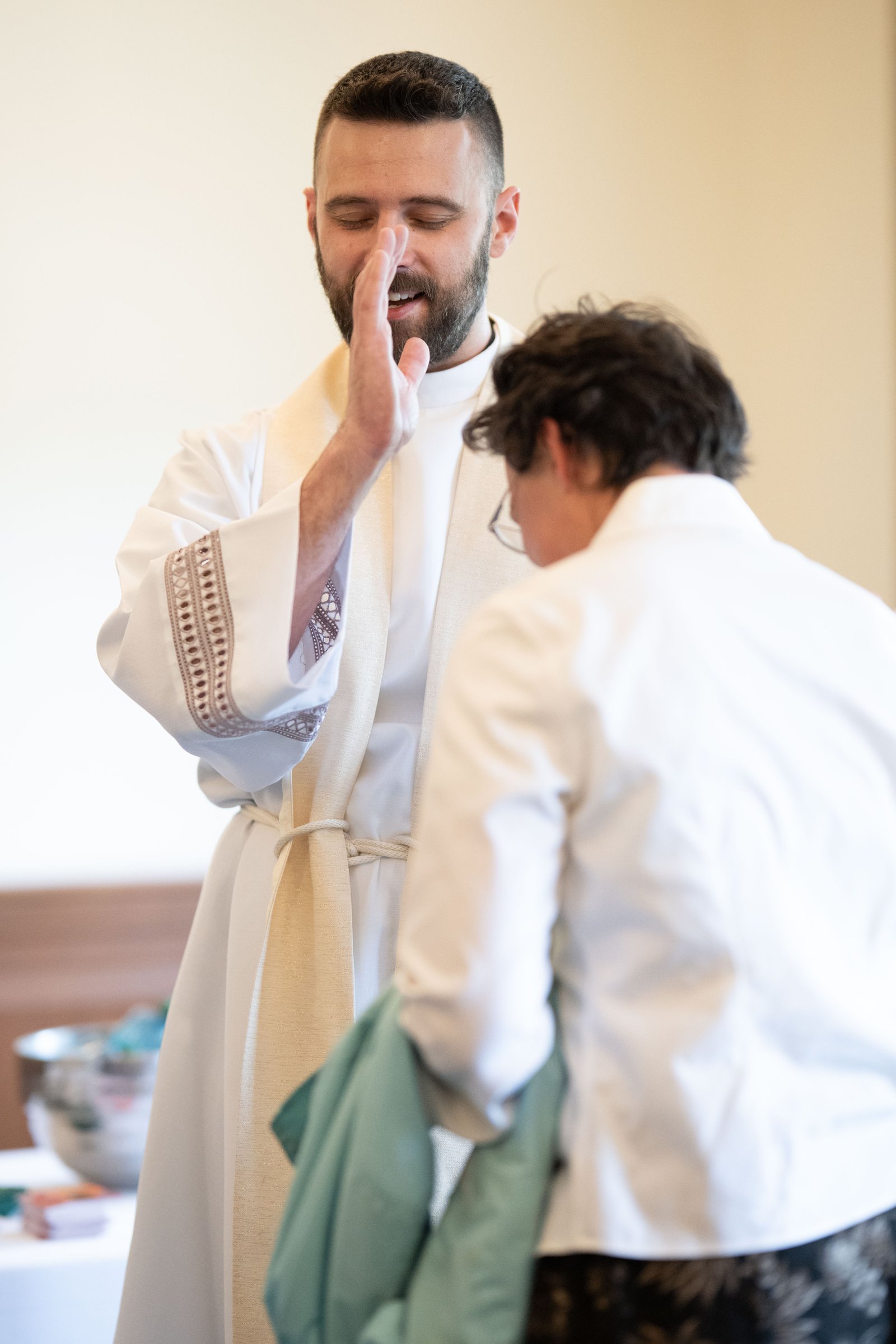 Fr. James Musgrave blesses friends, family and well-wishers at Sacred Heart Major Seminary following the ordination Mass.