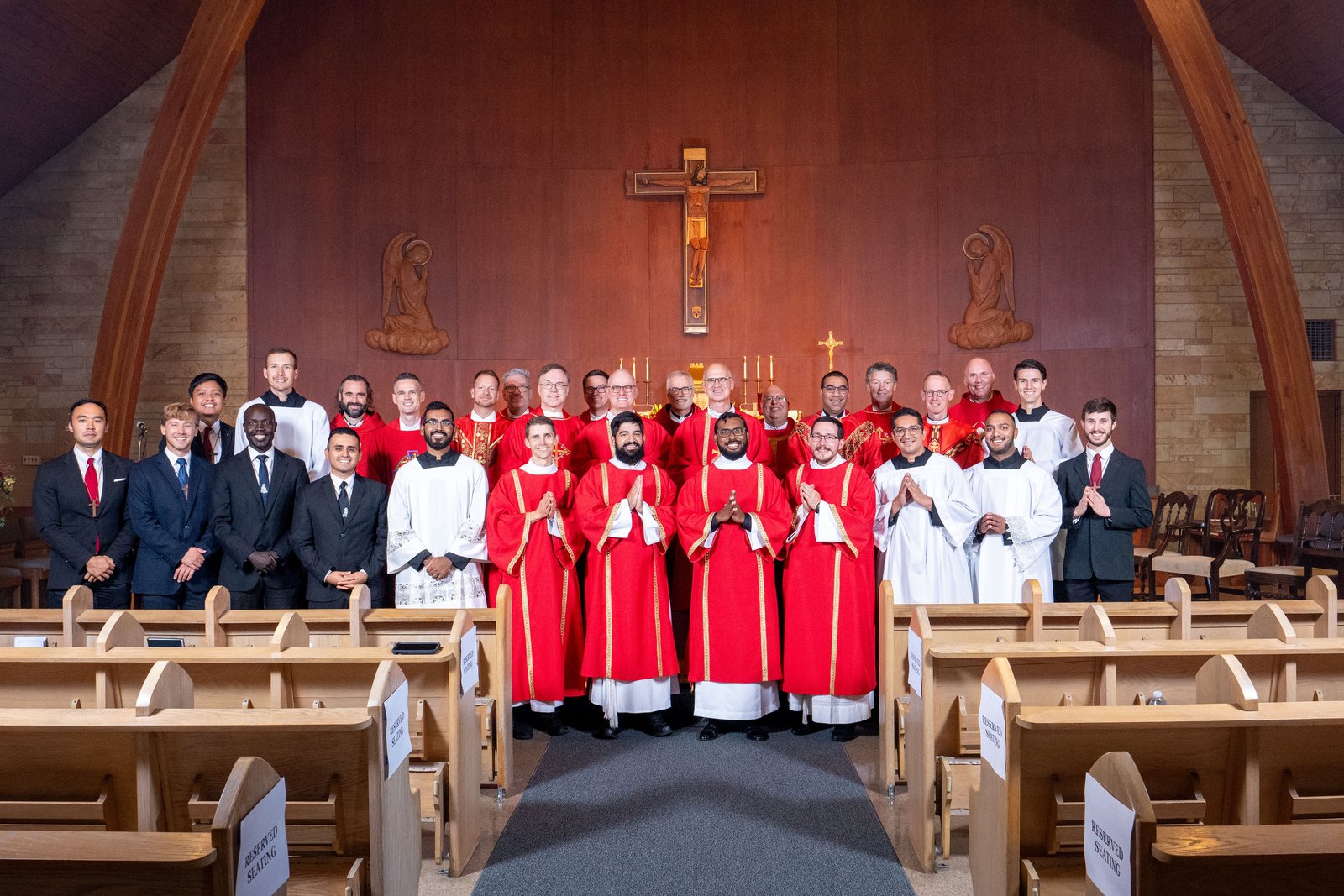 Deacons Sebastian Muggeridge, Michael Horianopoulos, Eran Amarasingh and Tim Silver are pictured with their Companions of the Cross brothers after their deaconate ordination on Sept. 14, 2024, at Holy Spirit Chapel in Detroit. (Tim Fuller | Courtesy of the Companions of the Cross)