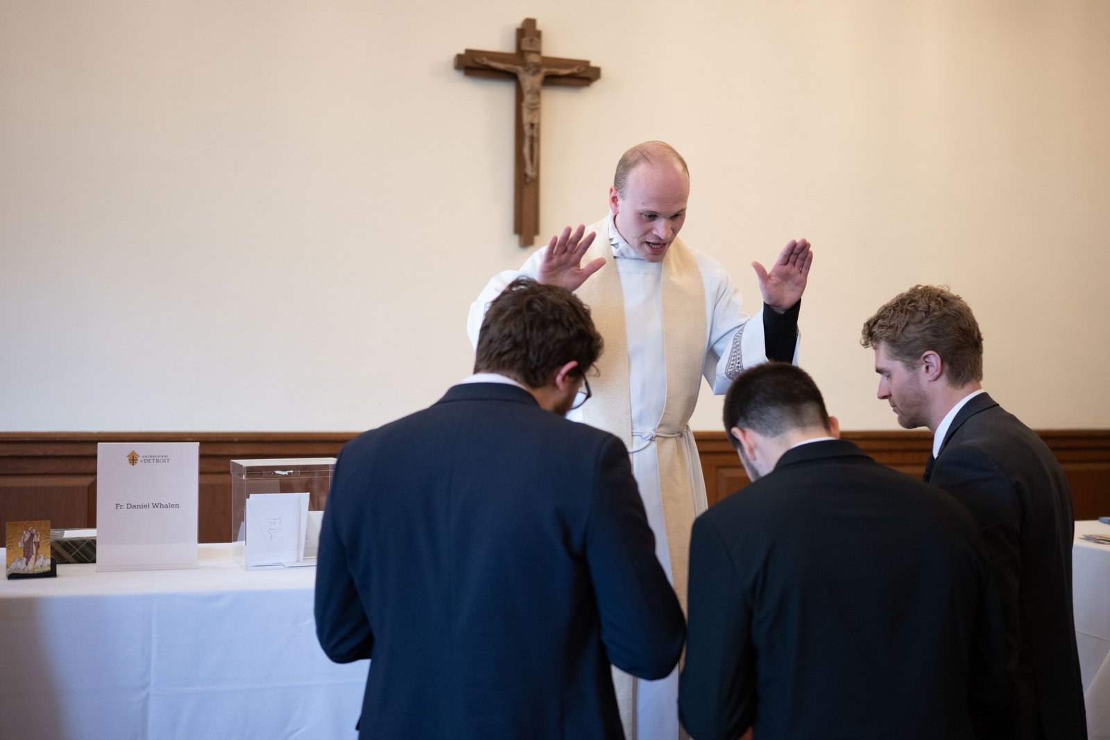 Fr. Daniel Whalen blesses friends, family and well-wishers at Sacred Heart Major Seminary following the ordination Mass.