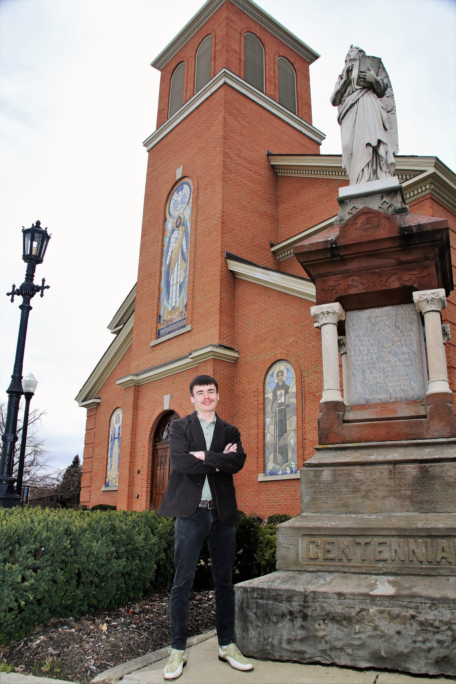 Trent Vecchiarino stands outside St. Mary of the Immaculate Conception Parish in Monroe. He plans to choose Blessed Solanus Casey as his confirmation saint and is looking forward to being baptized and receiving Christ for the first time in the Eucharist.