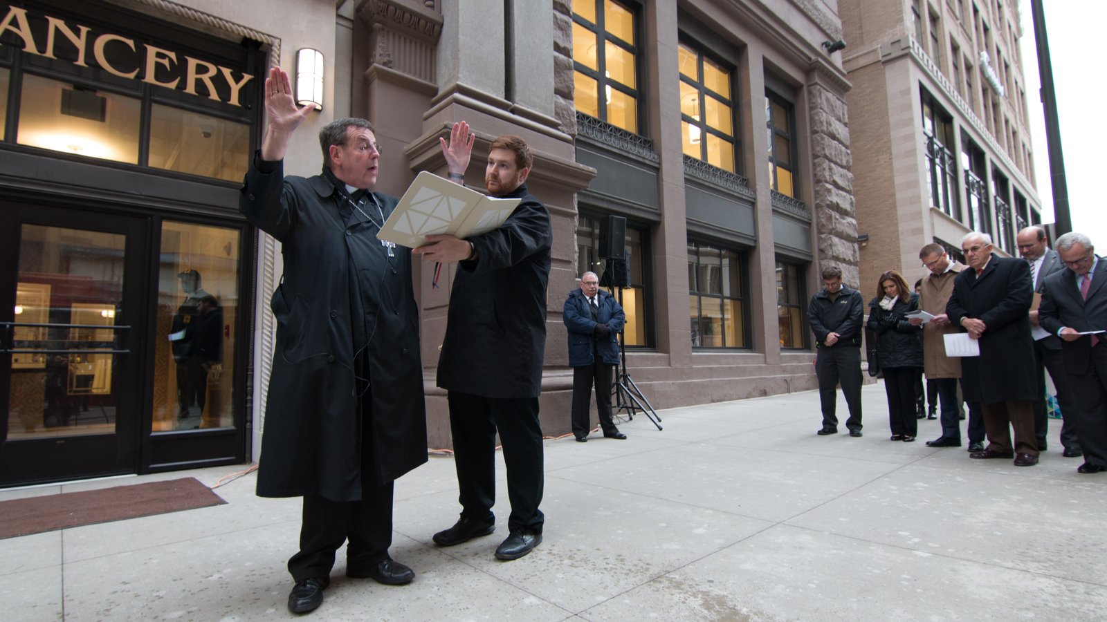 Archbishop Vigneron blesses a new tympanum commissioned for the archdiocesan Chancery in downtown Detroit on Dec. 1, 2016. In 2015, the archbishop led a move from the archdiocese's former Chancery on Washington Boulevard to its new location on State Street, keeping the archdiocese's central headquarters in downtown Detroit. (Jonathan Francis | Detroit Catholic file photo)