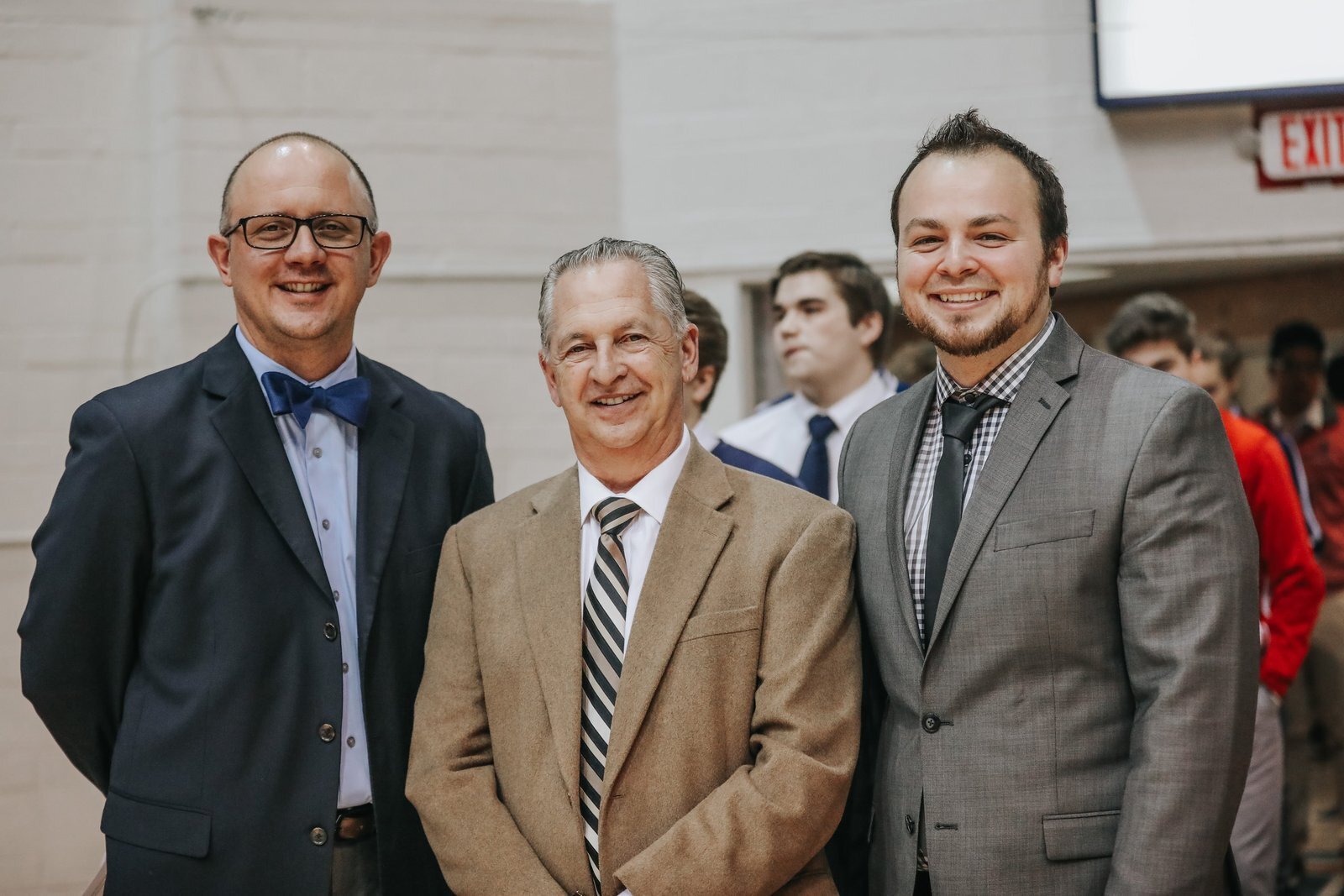 The late Vic Michaels, center, longtime director of the Catholic High School League, is pictured with current CHSL director Mike Evoy, left, and former league coordinator and current Mercy High School athletic director Brandon Malinowski. (Detroit Catholic file photo)