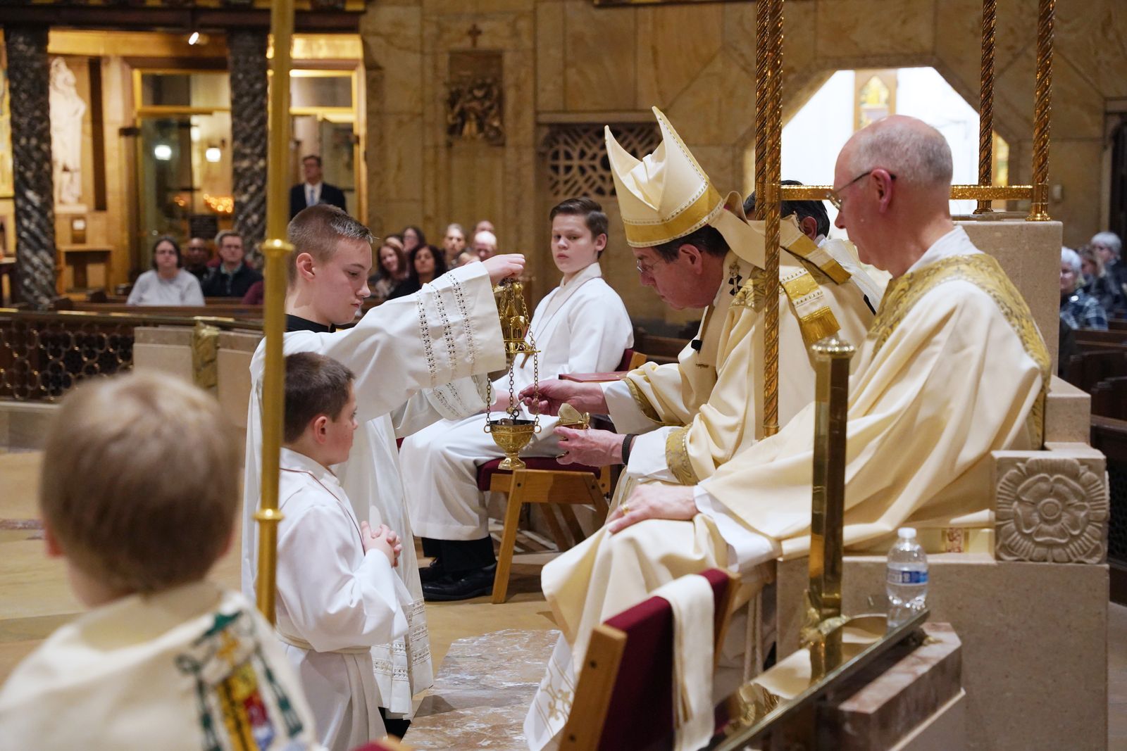 Archbishop Vigneron blesses the incense before the Gospel proclamation during the Vigil Mass for the Legal Protection of Unborn Life at the National Shrine of the Little Flower Basilica. The Mass, which took place the night before the national March for Life, was not meant to be a somber occasion, the archbishop said, but an opportunity to celebrate life.