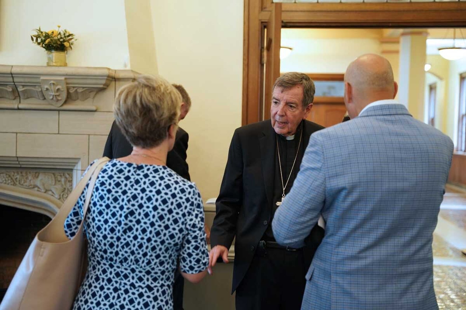 Well-wishers congratulate Archbishop-emeritus Vigneron during a reception in Sacred Heart Major Seminary's Bishop Gallagher Parlor after Mass.