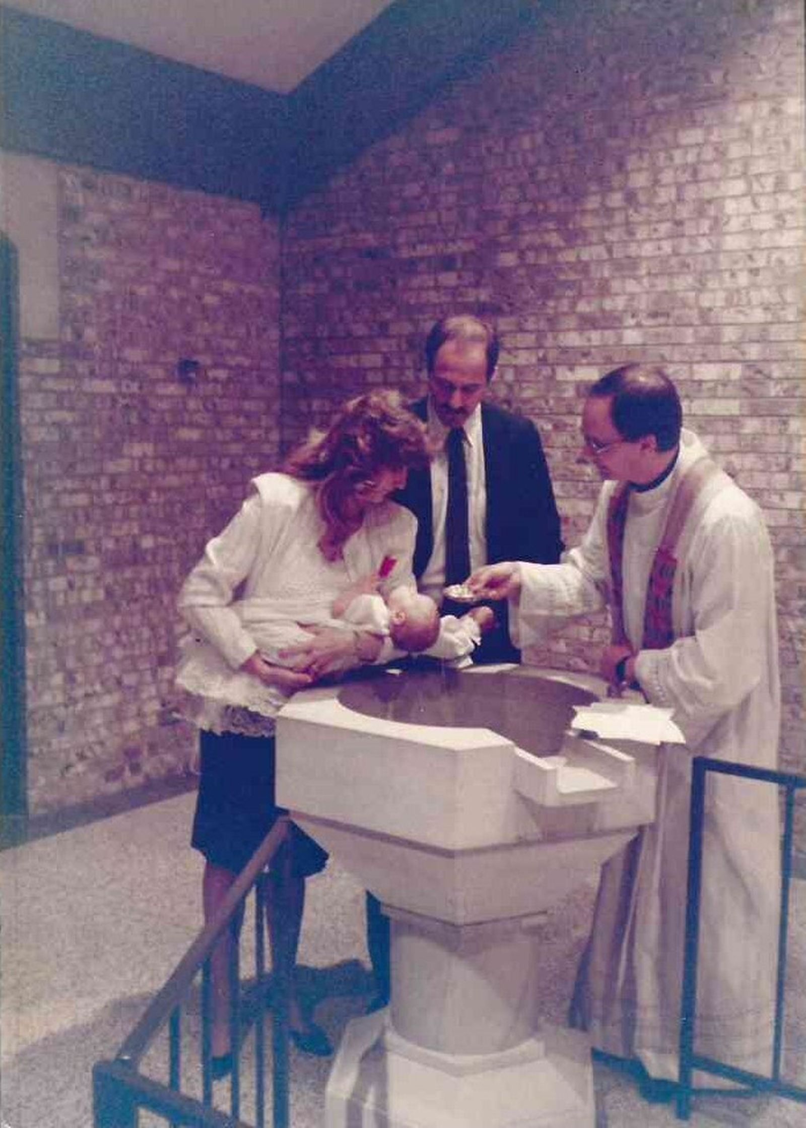 Then-Fr. Weisenburger baptizes his nephew, David Evan Heller, early in his priesthood. As a newly ordained priest, he served for three years in parish ministry in Ponca City, Oklahoma, before studying canon law at the University of St. Paul in Ottawa, Canada. He returned to the Archdiocese of Oklahoma City in 1992 and began working in the archdiocesan chancery, in addition to weekend parish work.