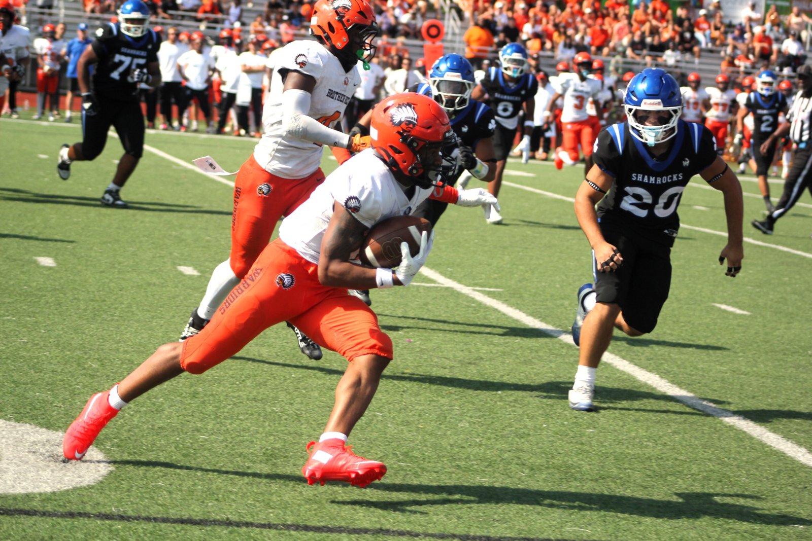 Brother Rice wide receiver Jacob Johnson looks for first-down yardage after hauling in a pass from Sam Eyde in a game at Novi Detroit Catholic Central earlier this season.
