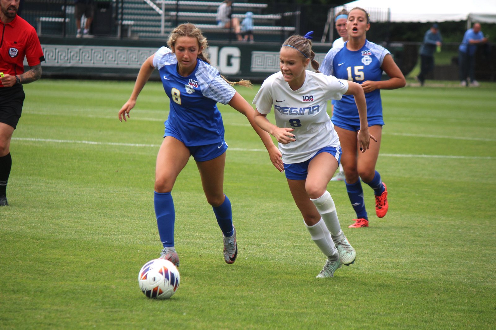 Catholic Central’s Emma Zamzam and Regina’s Elyse Mlynarek vie for a 50-50 ball at midfield.