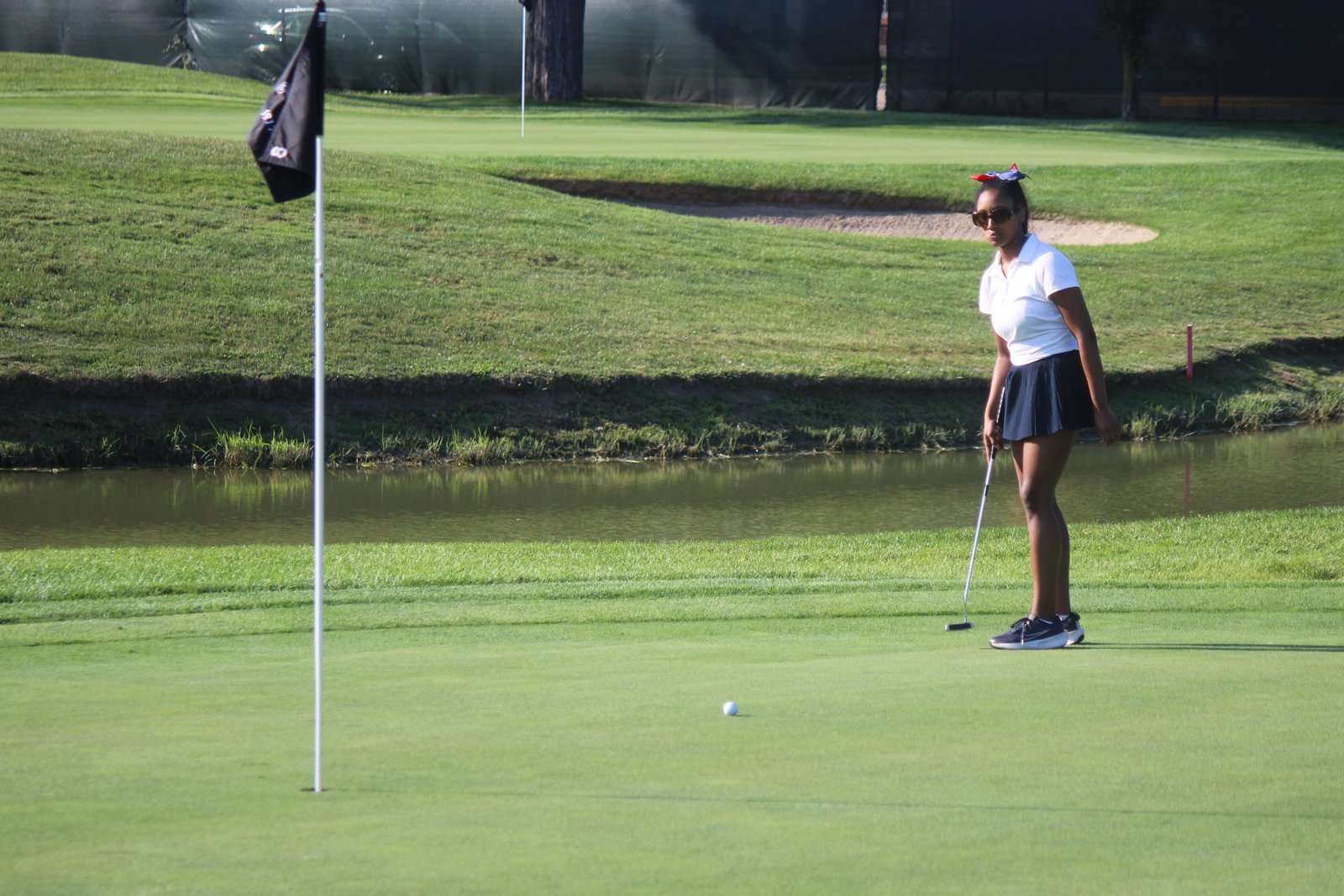 Ty’Lynn Thornton follows the path of her putt toward the hole. Thornton is a new golfer playing on University-Liggett’s newest team.