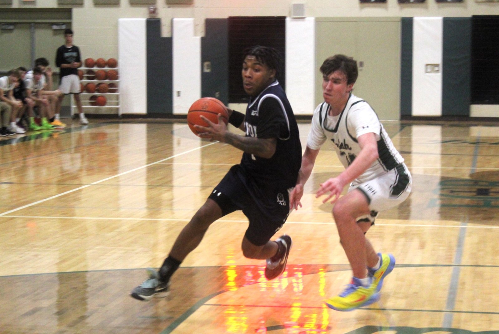 With the ball in his hands, Jai’Ron Foster makes his move to the basket. Foster, part of a strong senior class on the Loyola basketball team, has played on the varsity since his freshman season.