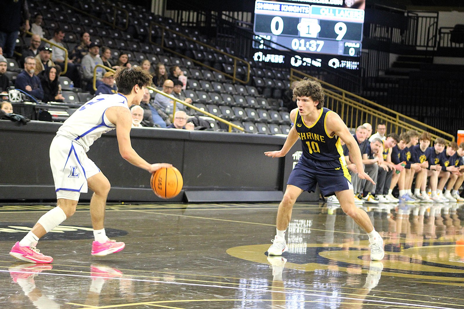 Royal Oak Shrine didn’t let an early deficit get into their heads, staying the course before beating Waterford Our Lady of the Lakes. Here, the Knights’ Michael Bowker defends as the Lakers’ Alex Asai brings the ball up the floor.