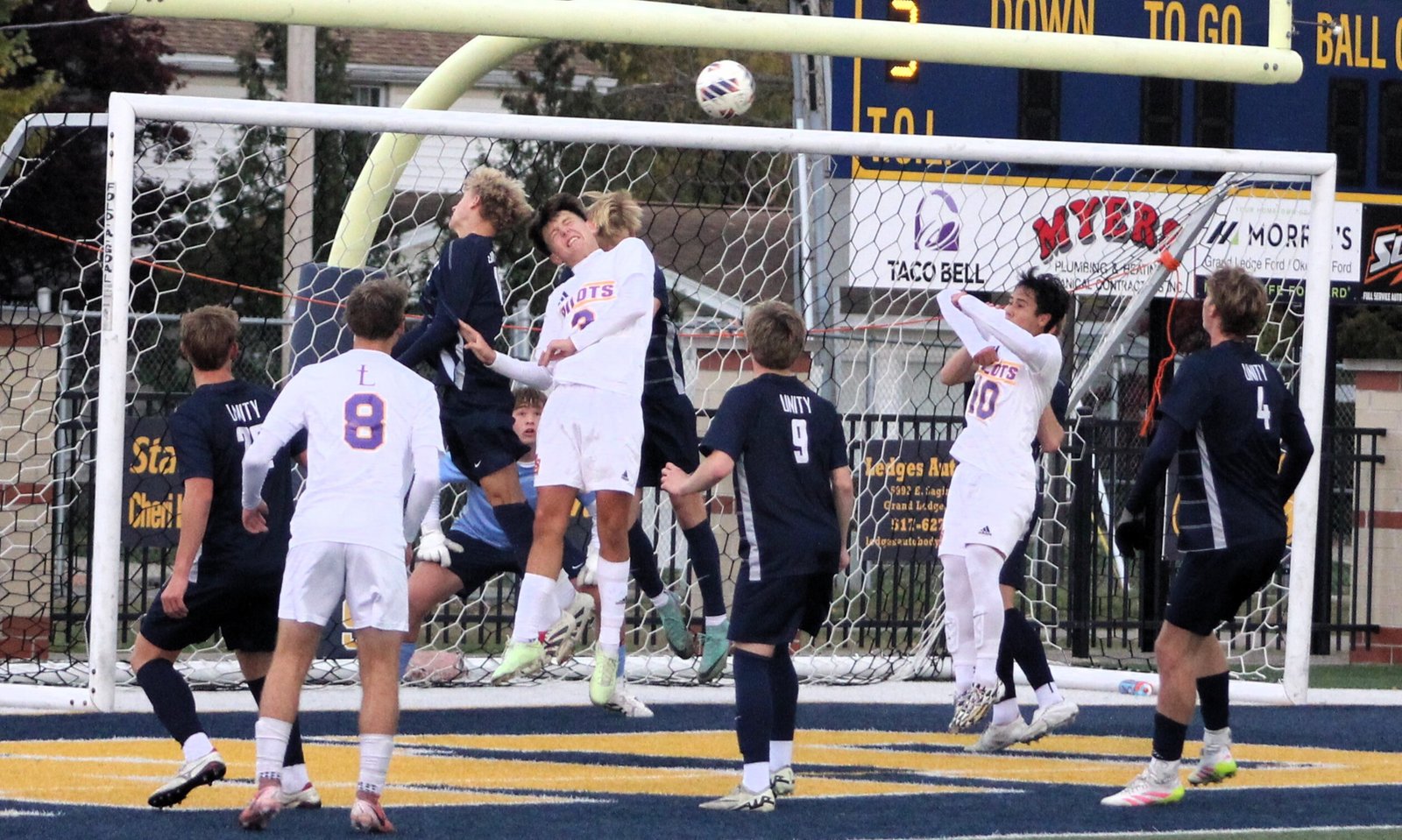 Rivald Nilaj (3) goes up for a header in the goal-box following a throw-in during first-half action of De La Salle’s 2-0 victory over Hudsonville Unity Christian in the MHSAA Division 2 state soccer championship match.