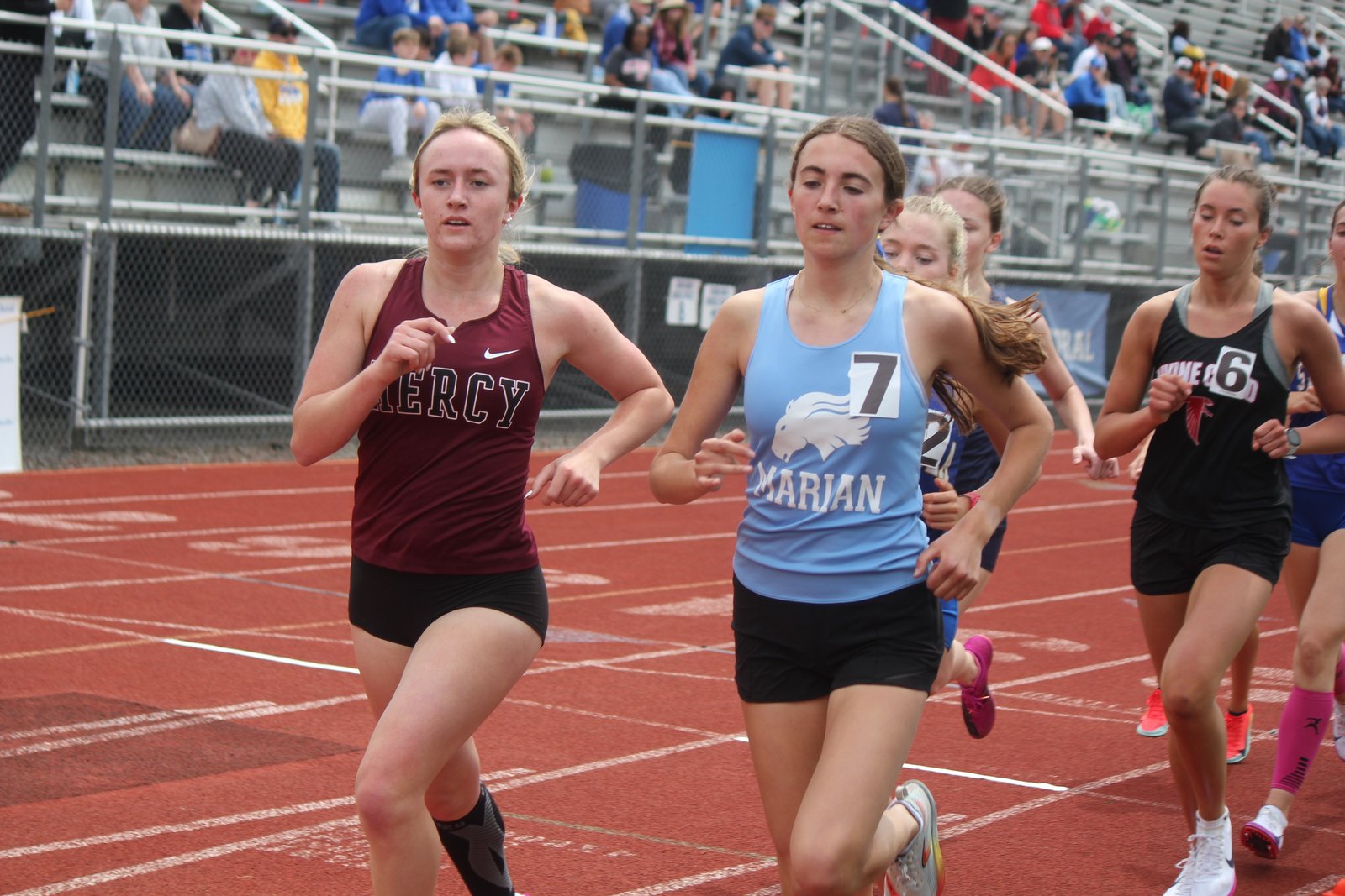 Farmington Hills Mercy’s Nora Gerzema and Bloomfield Hills Marian’s Lucille Clark lead the pack early in the 1600-meter run. Gerzema won the race in 5:23.90, shortly after she and her Marlin teammates set a new Catholic League record in the 4x800 relay.