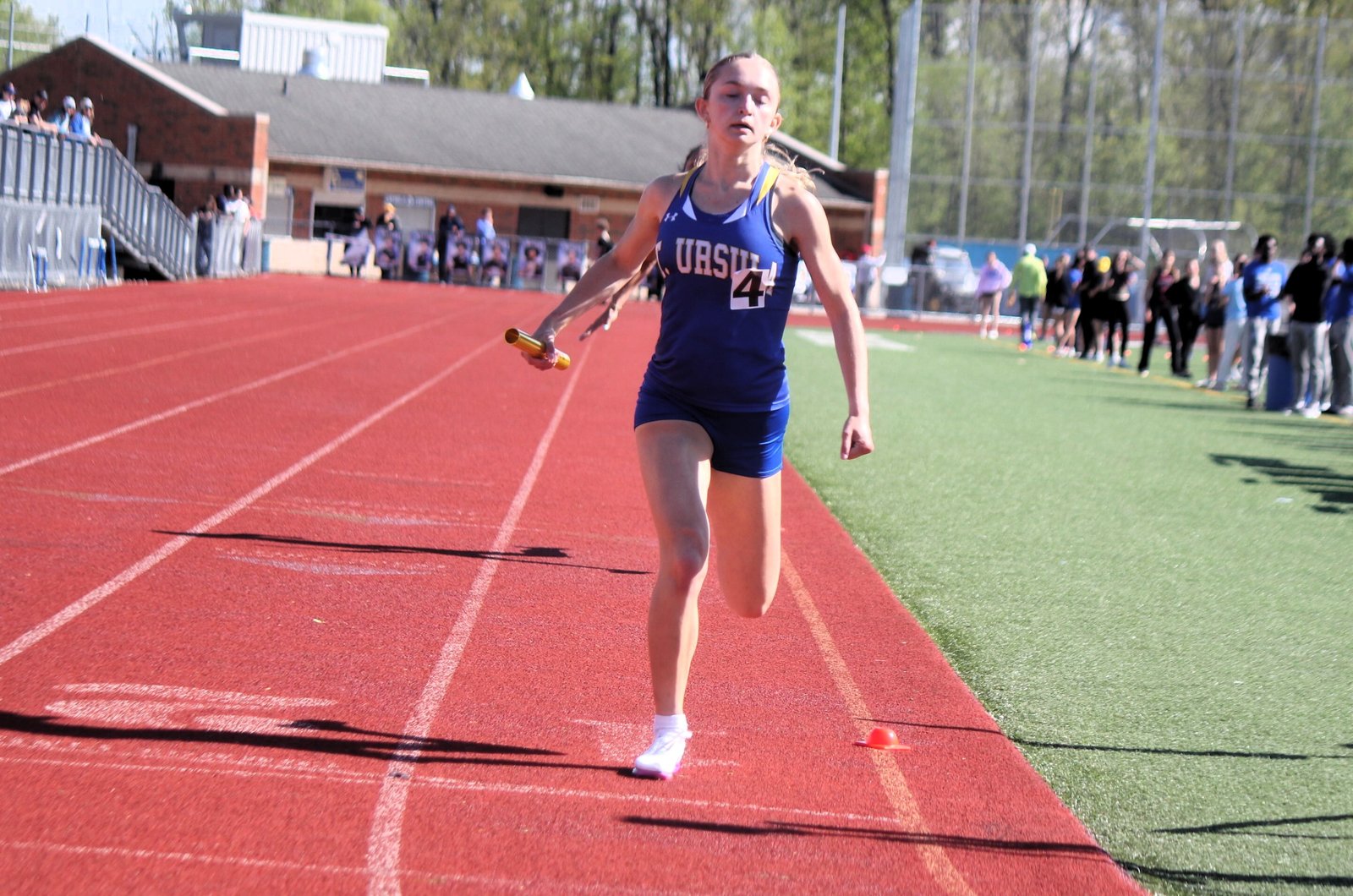 St. Ursula Academy freshman Emerie Schmidlin anchors the winning 4x400 relay for the Arrows. Earlier, Schmidlin finished first in the 800-meter run.