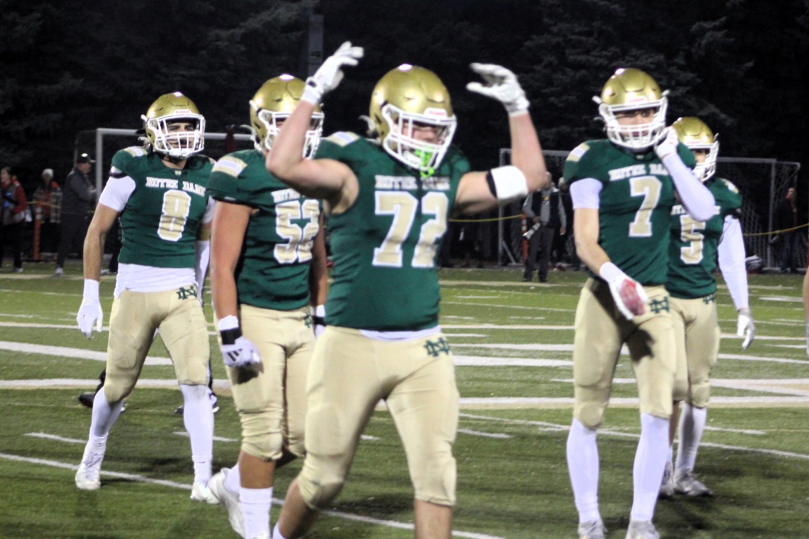 Notre Dame Prep’s defense, led by Henry Ewles (72), celebrate a fourth-down stop in the second half. The Fighting Irish got the ball back in Frankenmuth territory and scored on the next play when Brody Sink caught a touchdown pass.
