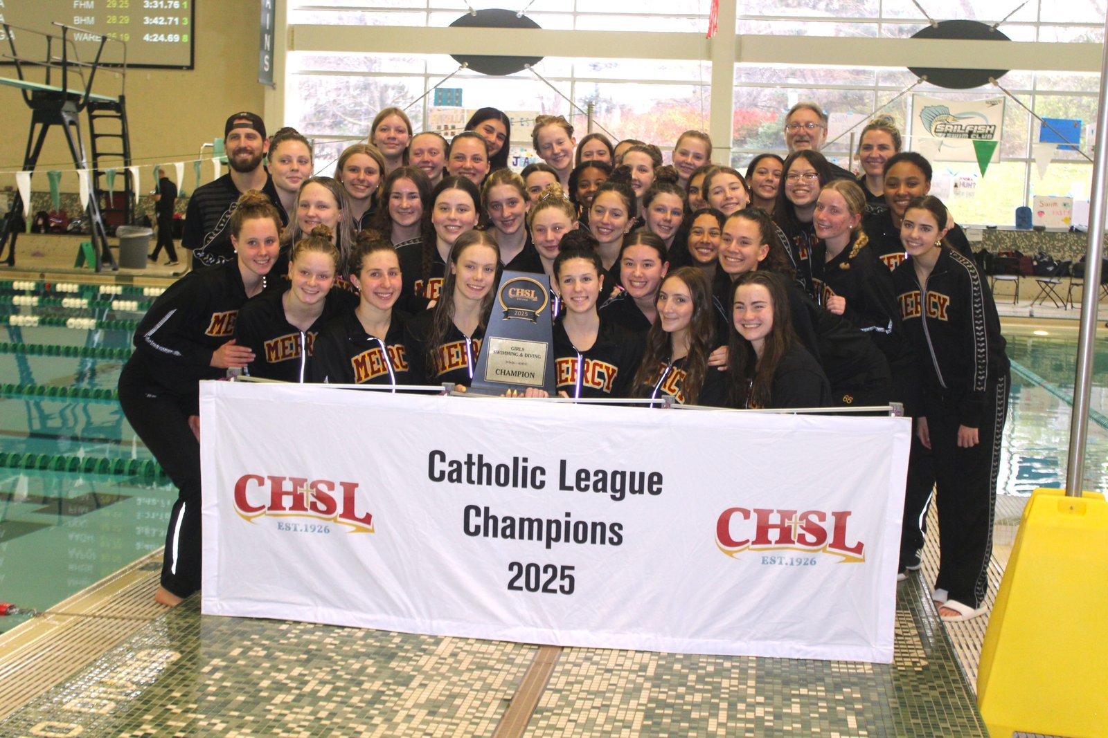 This is a familiar sight to Catholic League swimming and diving followers — Mercy claiming the championship trophy at the end of the day. The Marlins have won every Catholic League swim title, except one, dating back to 1967.