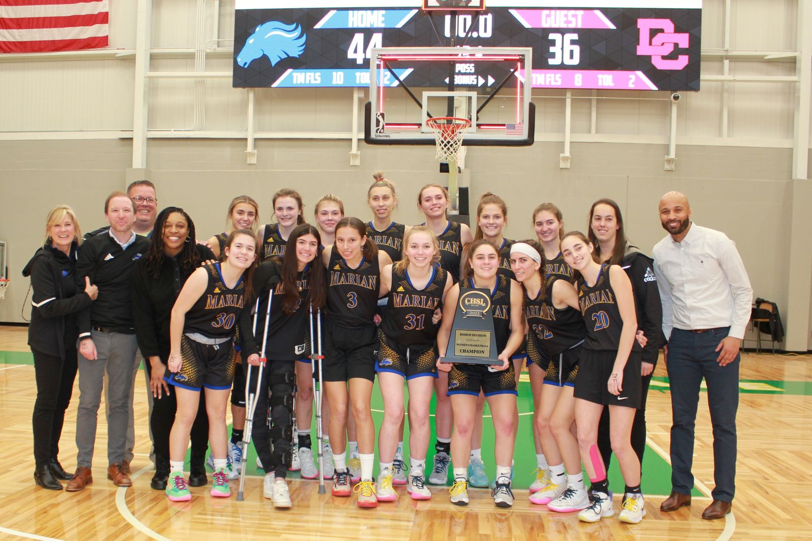 Marian’s championship was the school’s 20th under Cicerone (far left), who amassed over 700 wins in 39 seasons leading the Mustangs.