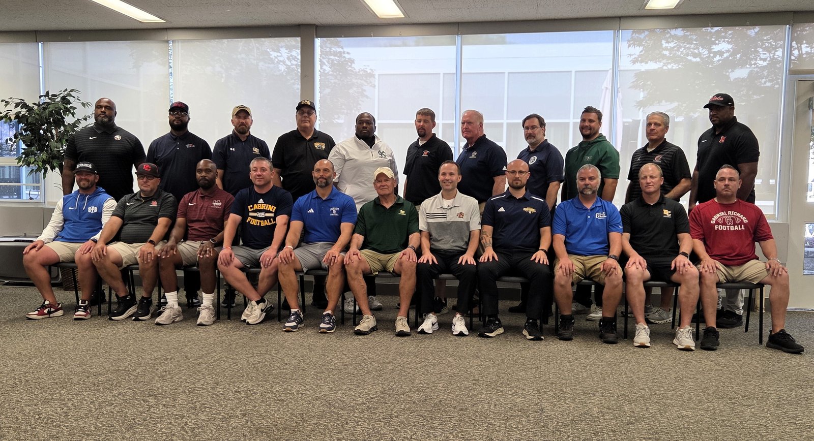 Catholic League football coaches gather at a pre-season meeting July 31 at Farmington Hills Mercy while discussing and preparing for the upcoming season.