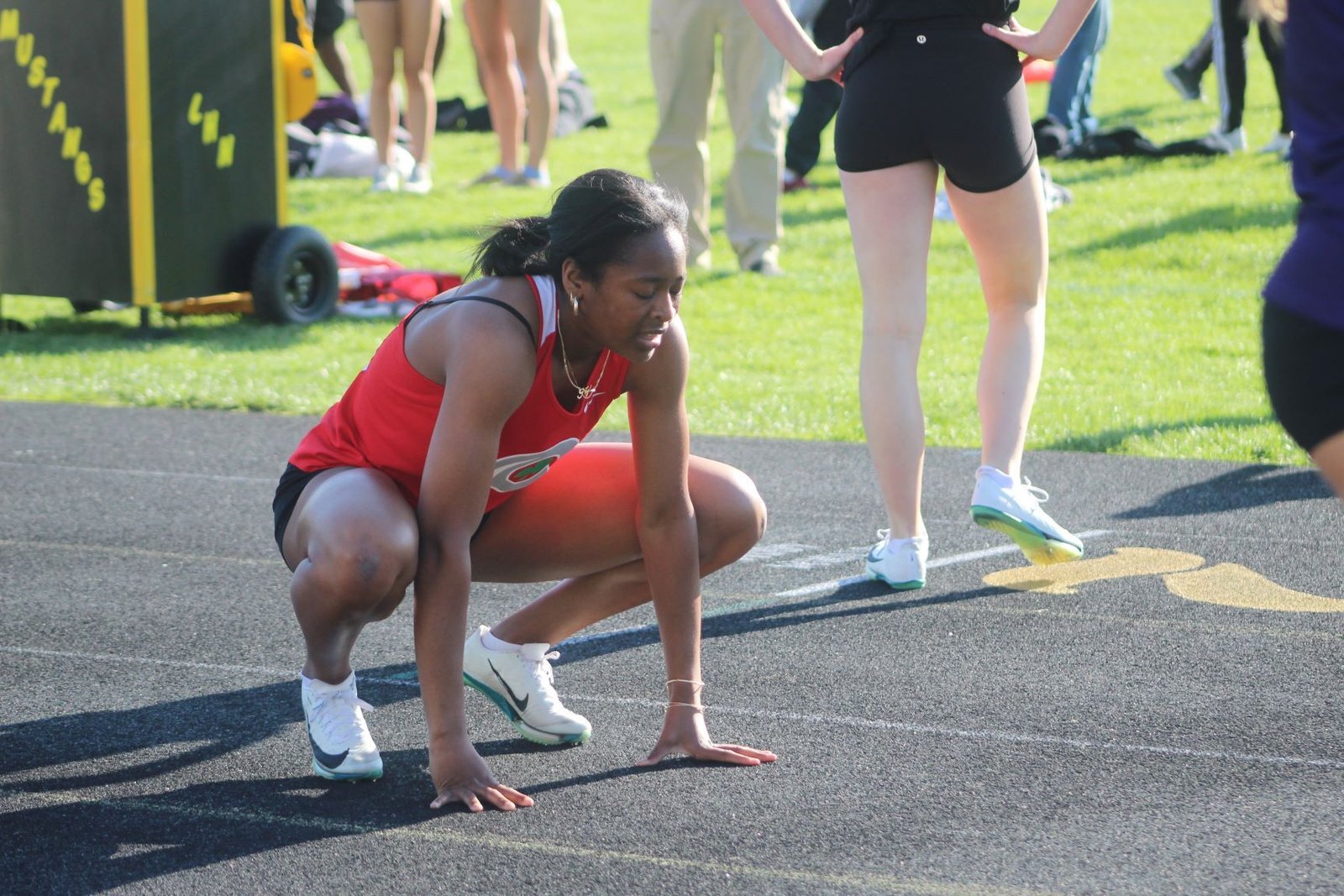 Toledo Central Catholic senior Nyla King catches her breath after winning the 400-meter dash in the CHSL’s Cardinal Division meet hosted by Macomb Lutheran North on May 9. King set a record in that race as well as the 200 dash, and also won the 100.