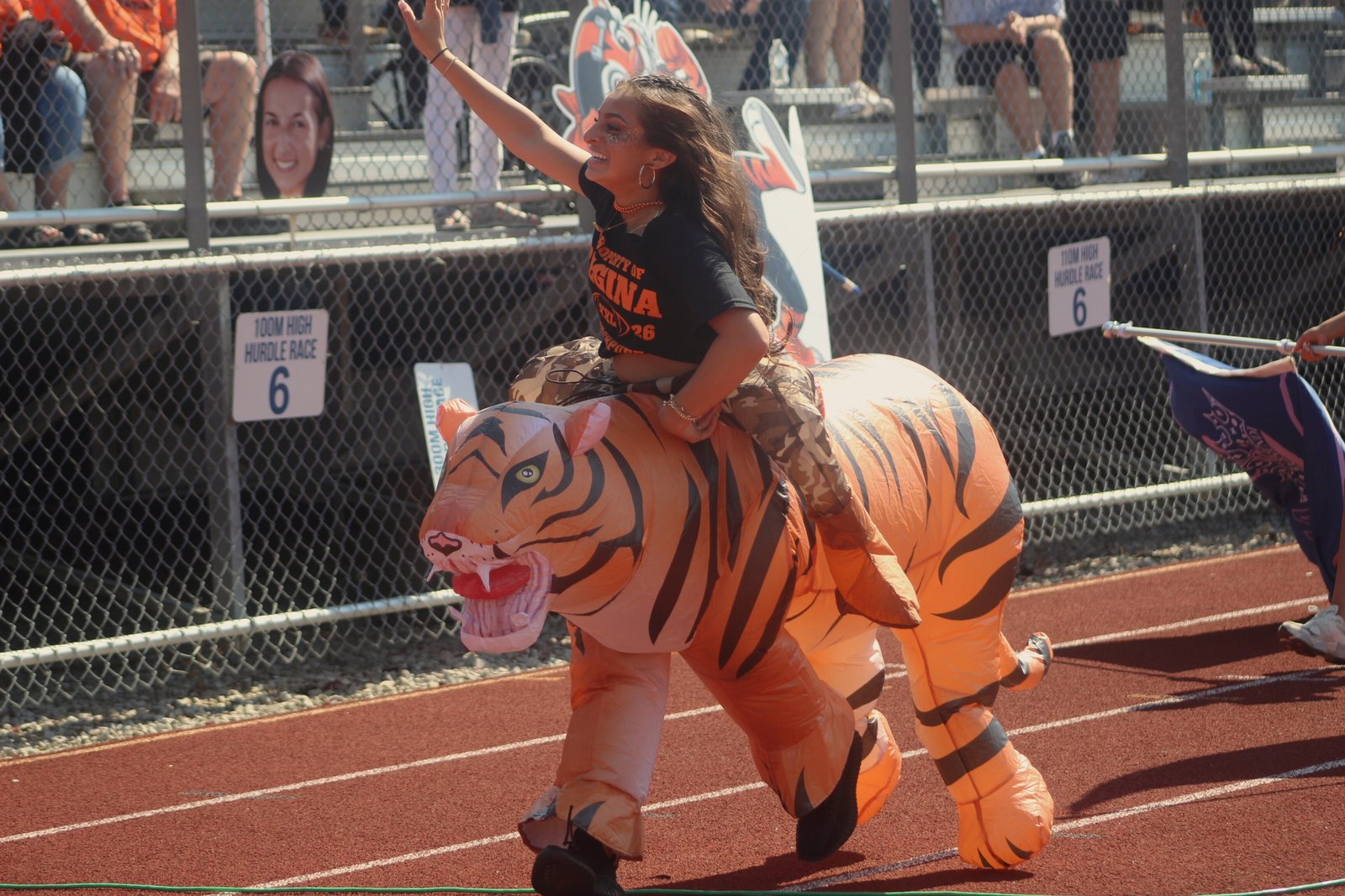 Gianna Yaldo hypes up the Regina student section in her inflatable riding-tiger costume.
