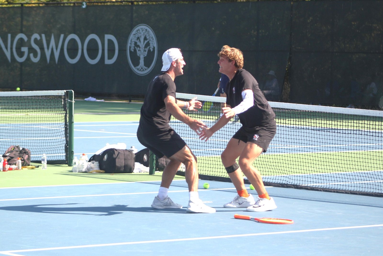 Birmingham Brother Rice’s Ben Waechter and Spencer Seneker celebrate their three-set victory over Cranbrook’s Cole Kerschenbaum and Ryan VanDyke, earning them the gold medal at number-one doubles.