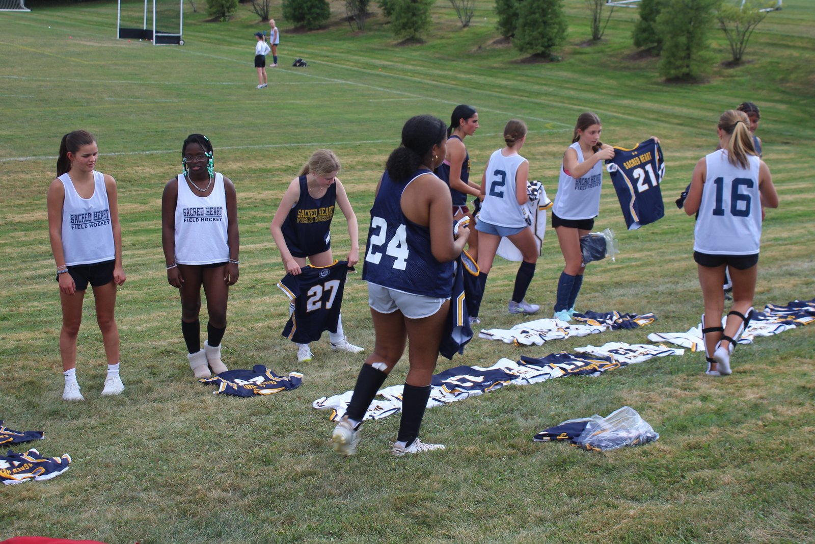 It’s jersey day at Bloomfield Hills Academy of the Sacred Heart, as players choose their uniform numbers following their afternoon workout on Sept. 2. Despite its small school size, Sacred Heart has a big history in field hockey throughout the years.