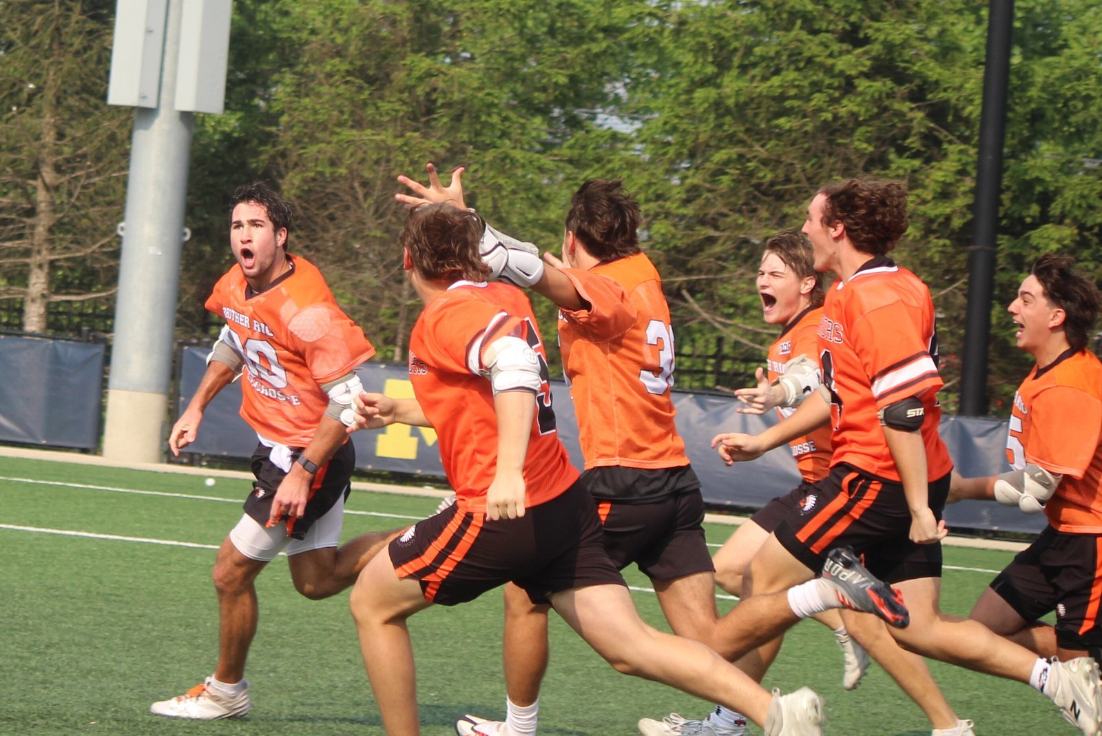 Brother Rice players celebrate with Ben Waechter (left), who scored the sudden-death winning goal 12 seconds into the overtime session.
