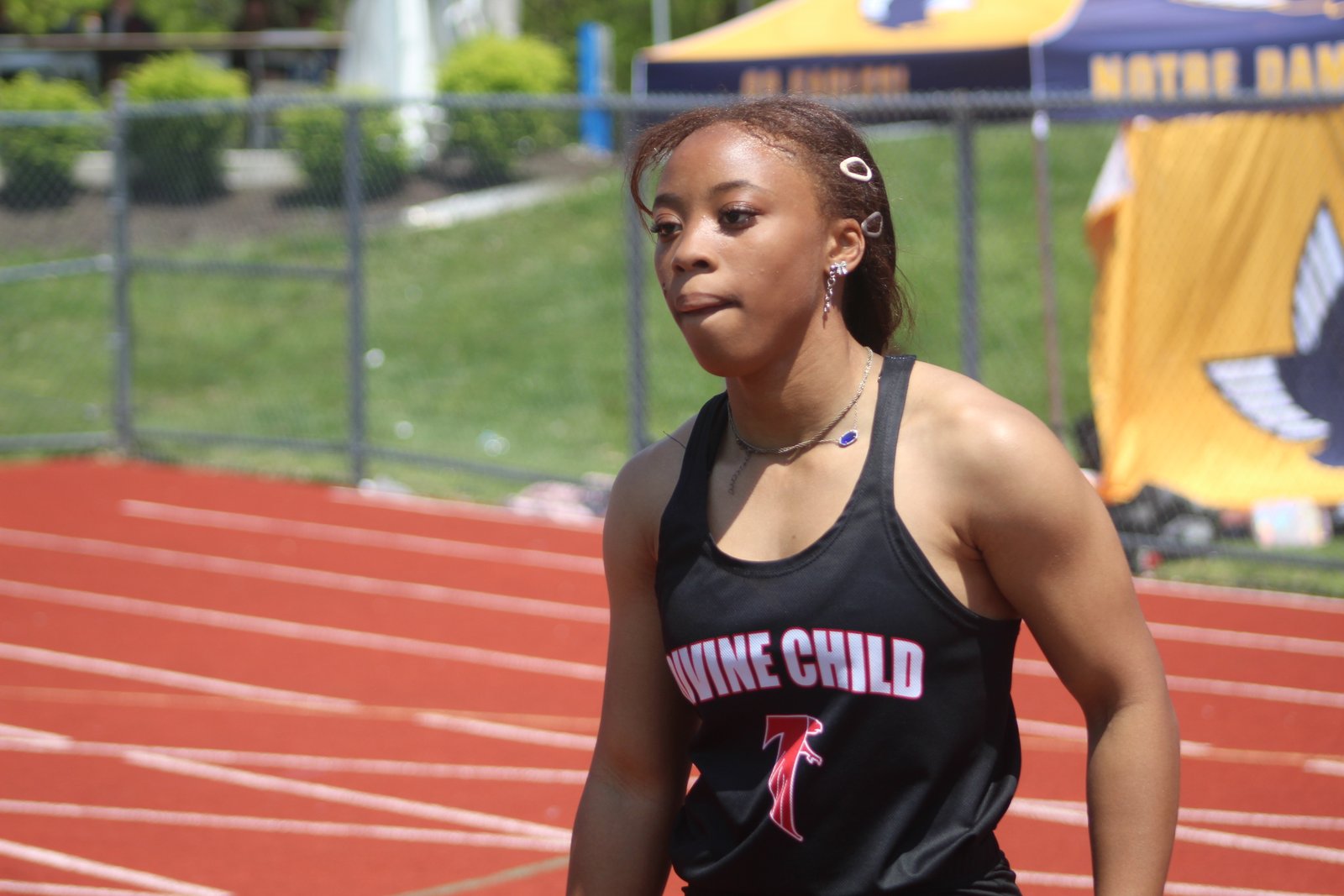 Dearborn Divine Child’s Aubrey Wilson set state records in both the 100- and 200-meter dashes in the MHSAA Division 2 championship at Hudsonville. Behind Wilson, the Falcons completed the day in fourth place.